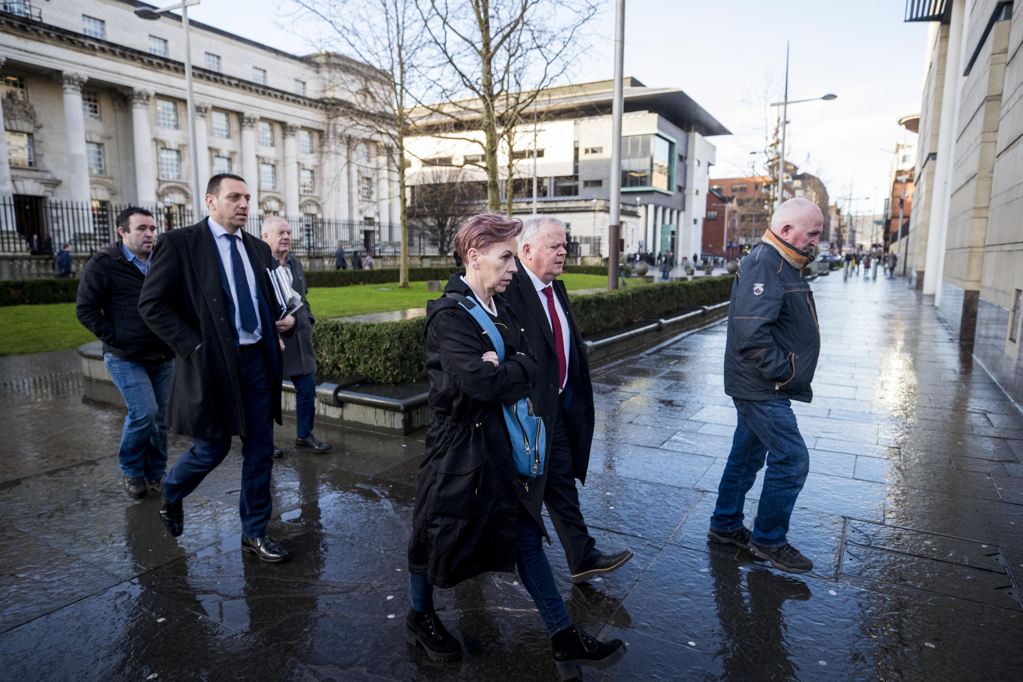 Keiran Fox (son of Eamon Fox, left), solicitor Padraig O'Muirigh (2nd left) Raymond McCord Snr (father of Raymond McCord Jnr 3rd left), SDLP MLA John Dallat (2nd right) and Joe Convie (father of Gary Convie, right) arriving at Laganside courts in Belfas