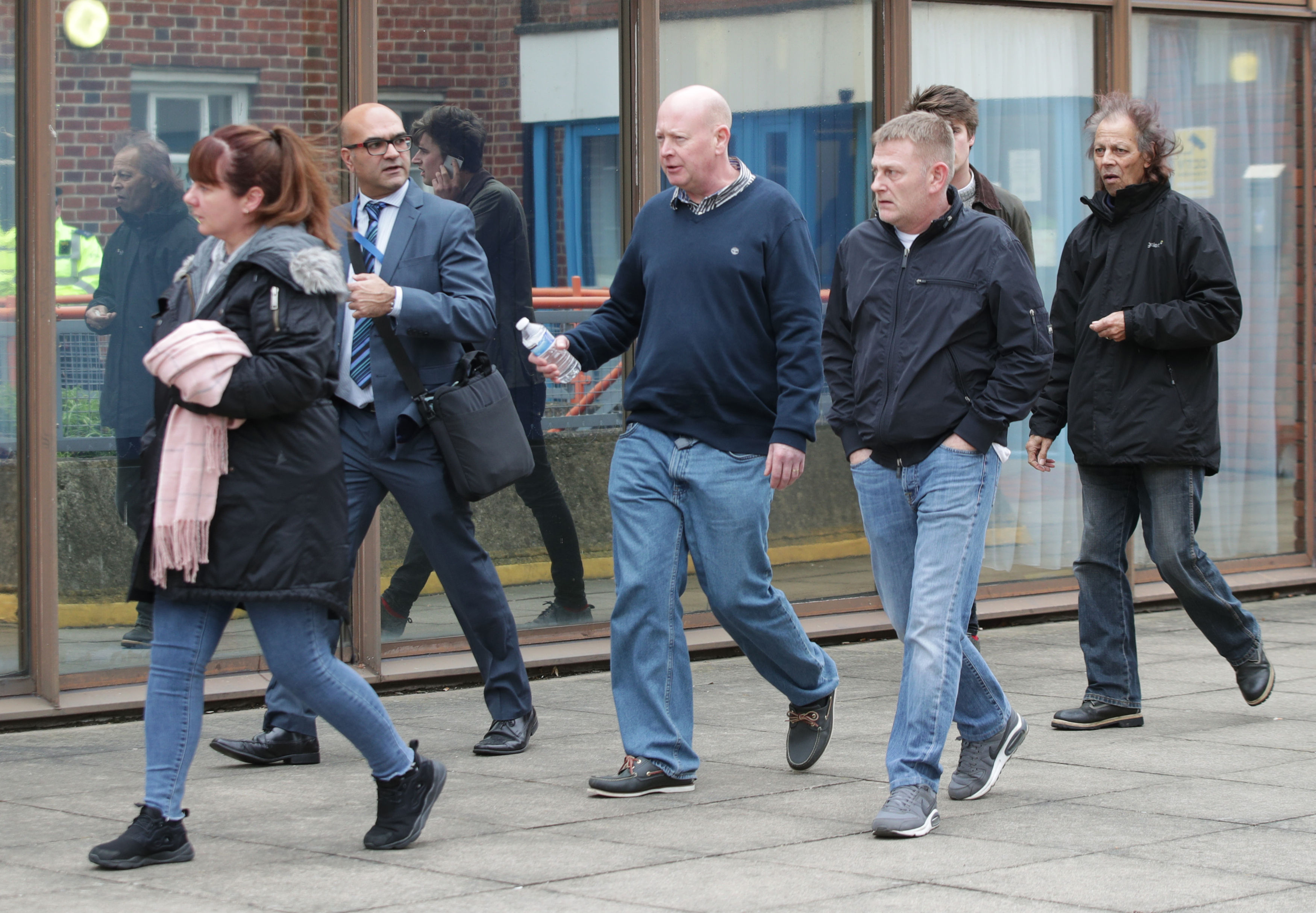 Friends and family of the three teenage boys leave Uxbridge Magistrates' Court