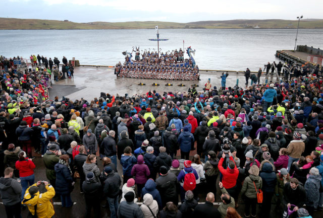 Members of the Jarl Squad dressed in Viking suits on the galley after marching through the streets in Lerwick (Jane Barlow/PA)