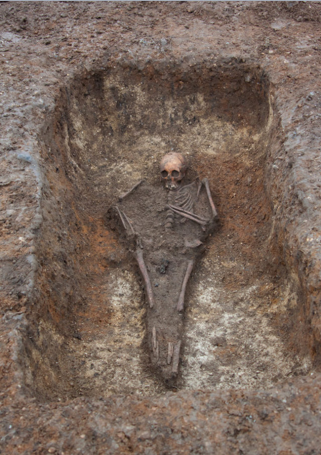 The cross was found in the rare "bed burial" of a teenage girl (Museum of Archaeology and Anthropology, University of Cambridge/PA)