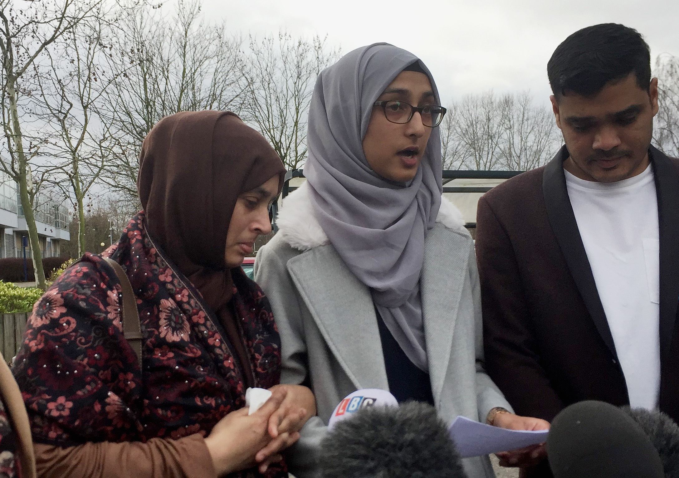 Ruzina Akhtar, centre, the daughter of Finsbury Park attack victim Makram Ali, reads a statement outside Woolwich Crown Court (Sally Wardle/PA)