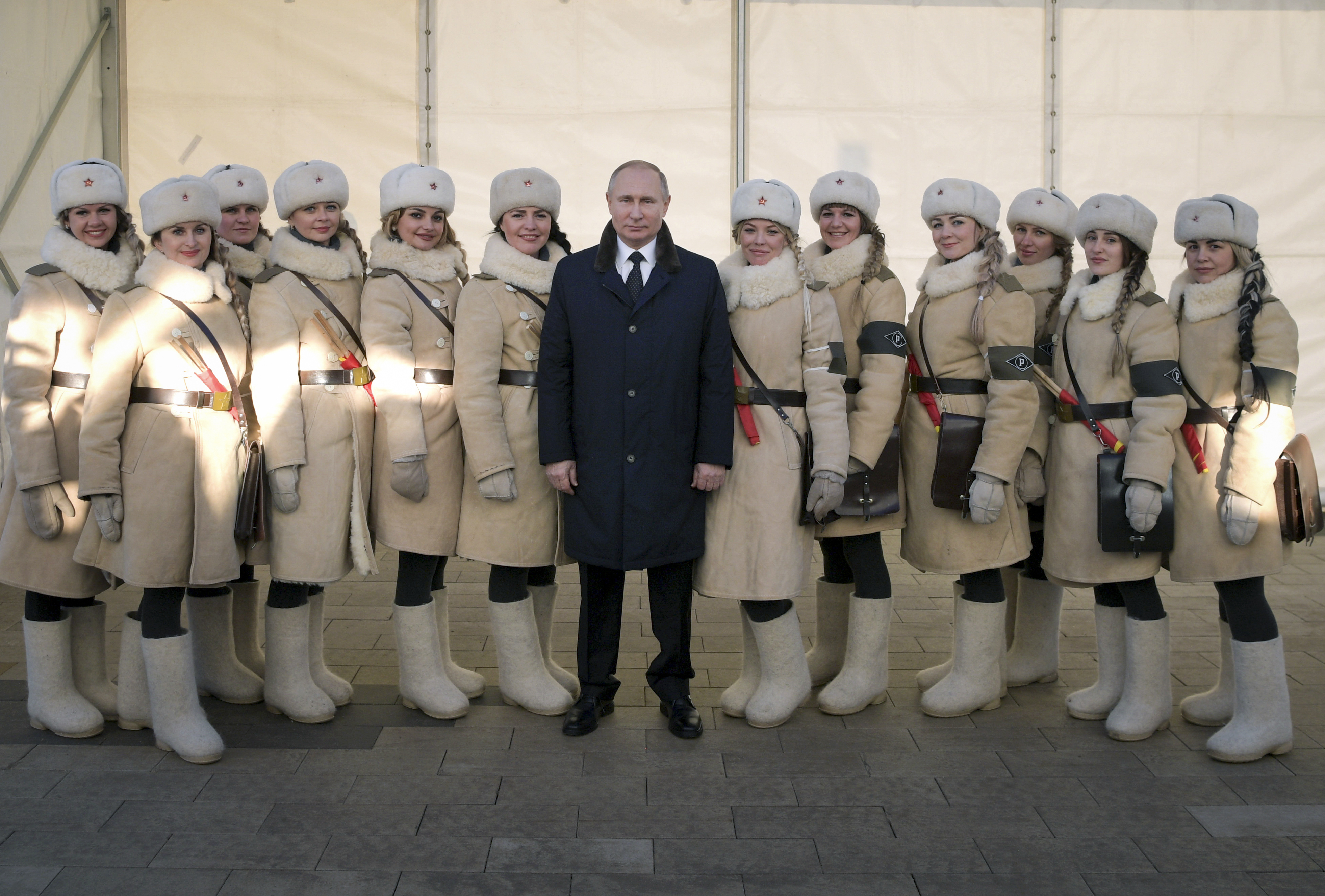 President Vladimir Putin with women dressed in historic Red Army uniforms (Alexei Druzhinin/AP)