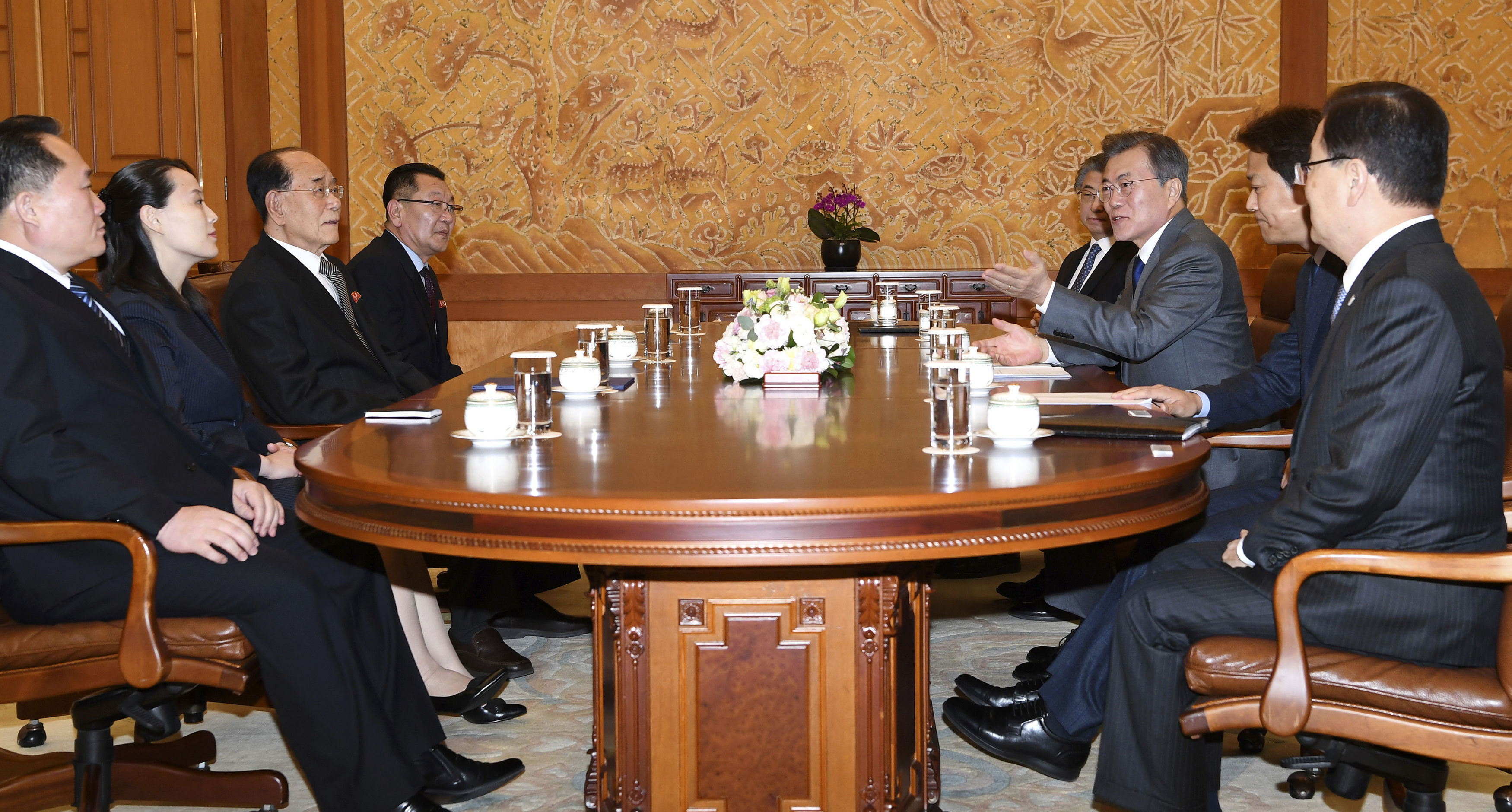 South Korean President Moon Jae-in, third from right, speaks to Kim Yo Jong, second from left, and a North Korean delegation during a meeting in Seoul (Kim Ju-sung/Yonhap via AP)