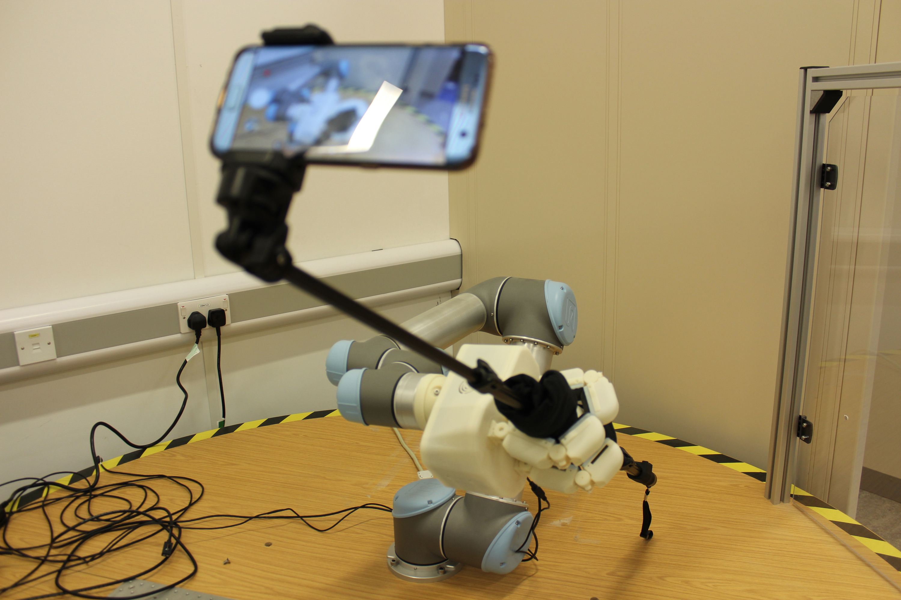 A robot taking a selfie.