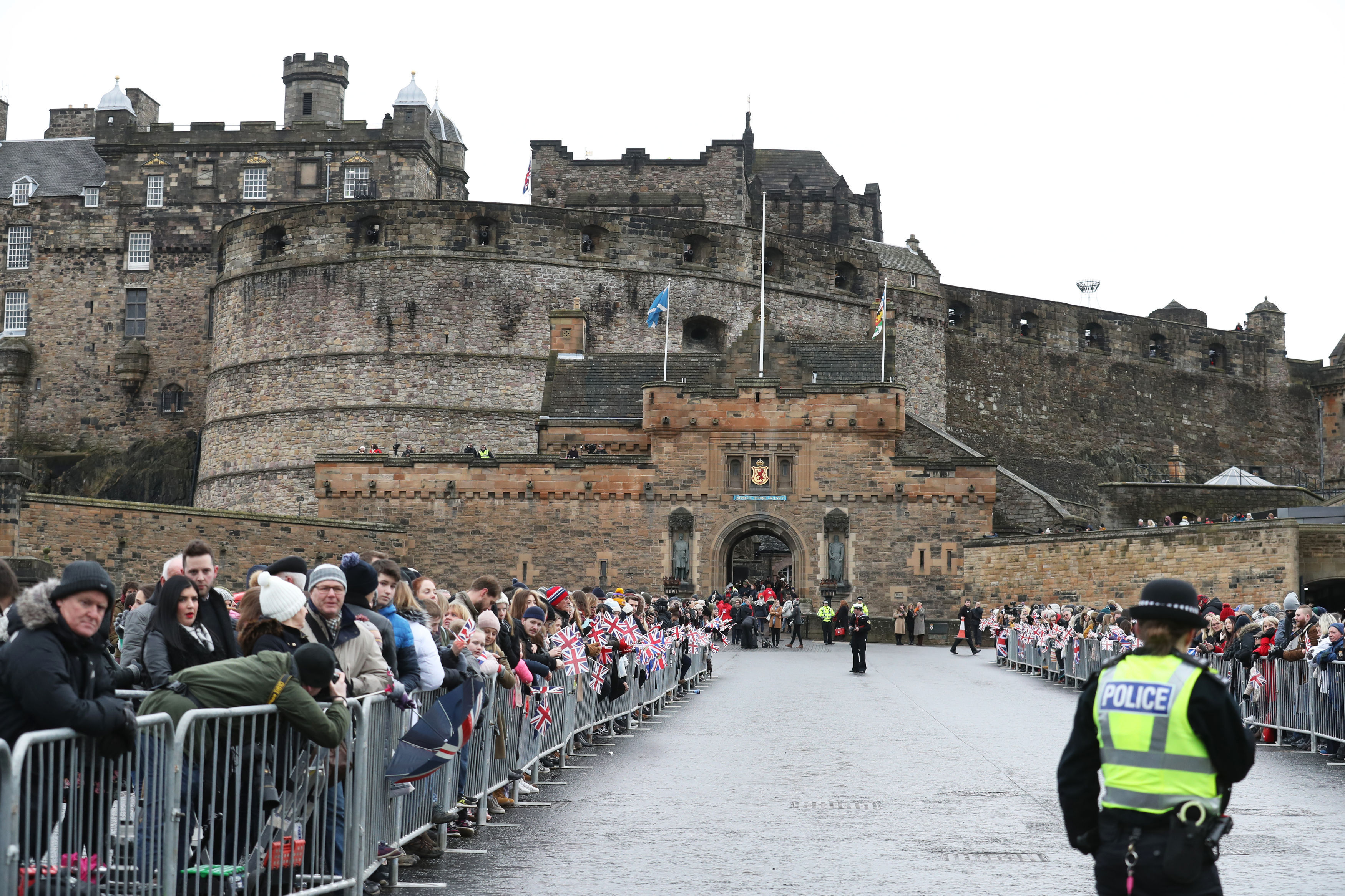 Crowds gather ahead of a visit by Prince Harry and Meghan Markle to Edinburgh Castle (Andrew Milligan/PA)