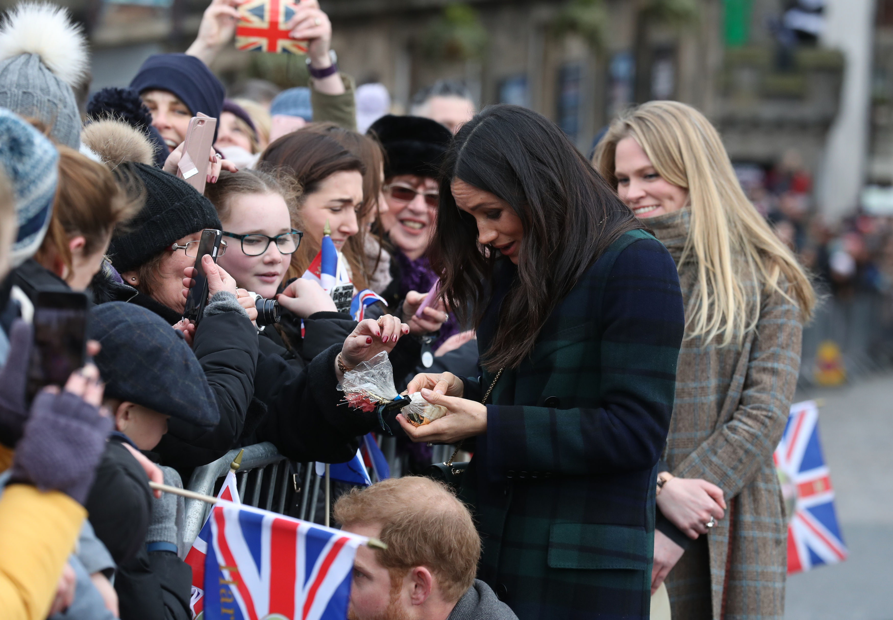 Meghan Markle in a tartan coat during a walkabout (Andrew Milligan/PA)