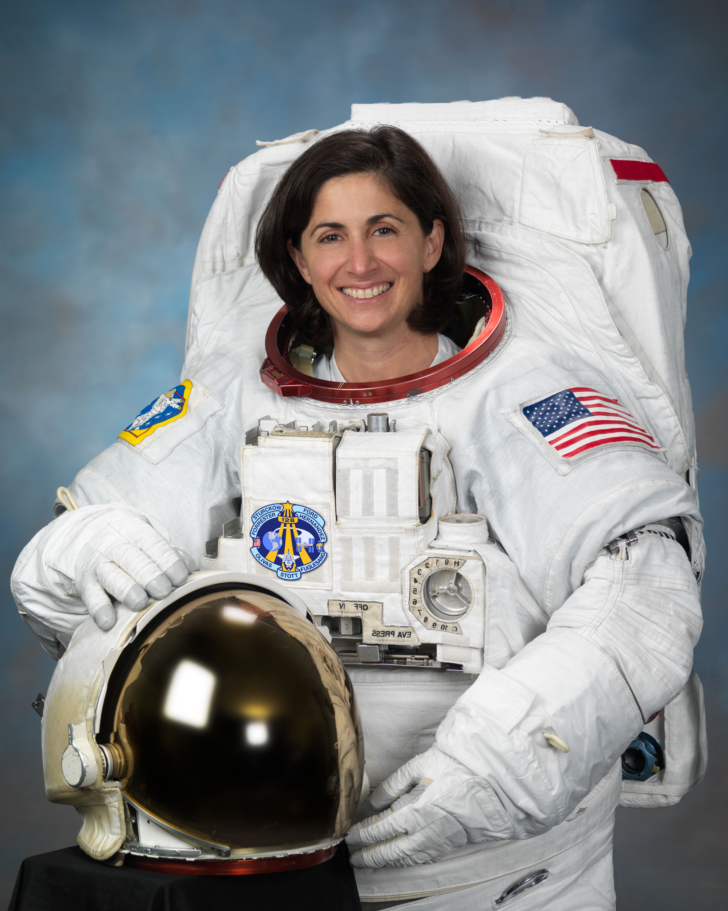 Official Portrait of NASA Astronaut Nicole Stott in an EUM. Photo Date: July 26, 2011. Location: Building 8, Room 183 - Photo Studio. Photographer: Robert Markowitz