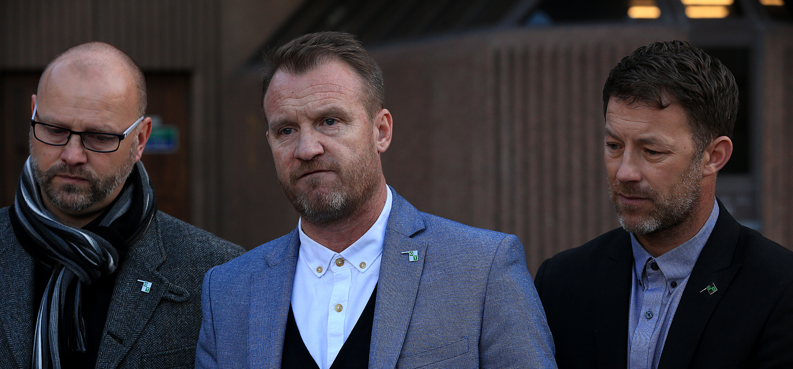 Chris Unsworth (left), Micky Fallon (centre) and Steve Walters (right), victims of Barry Bennell, speak to the media outside Liverpool Crown Court where the serial paedophile was convicted of abusing more young footballers. (Peter Byrne/PA)