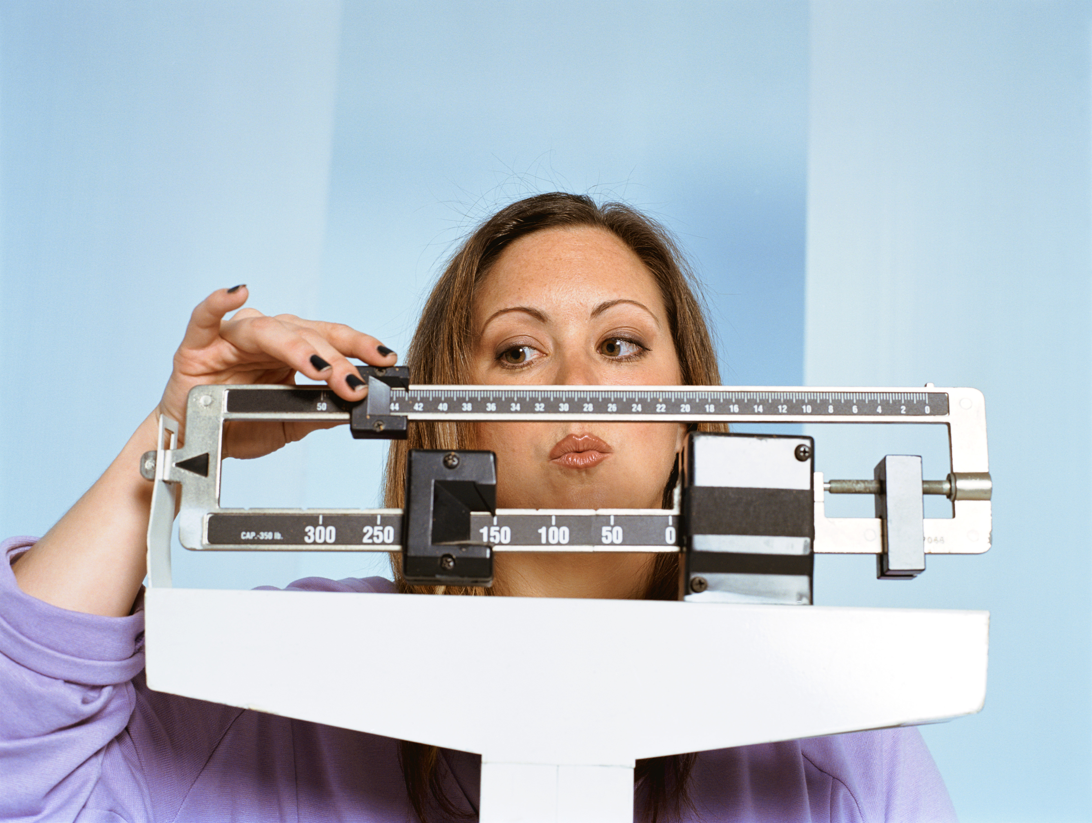 Generic photo of woman on a weighing scales