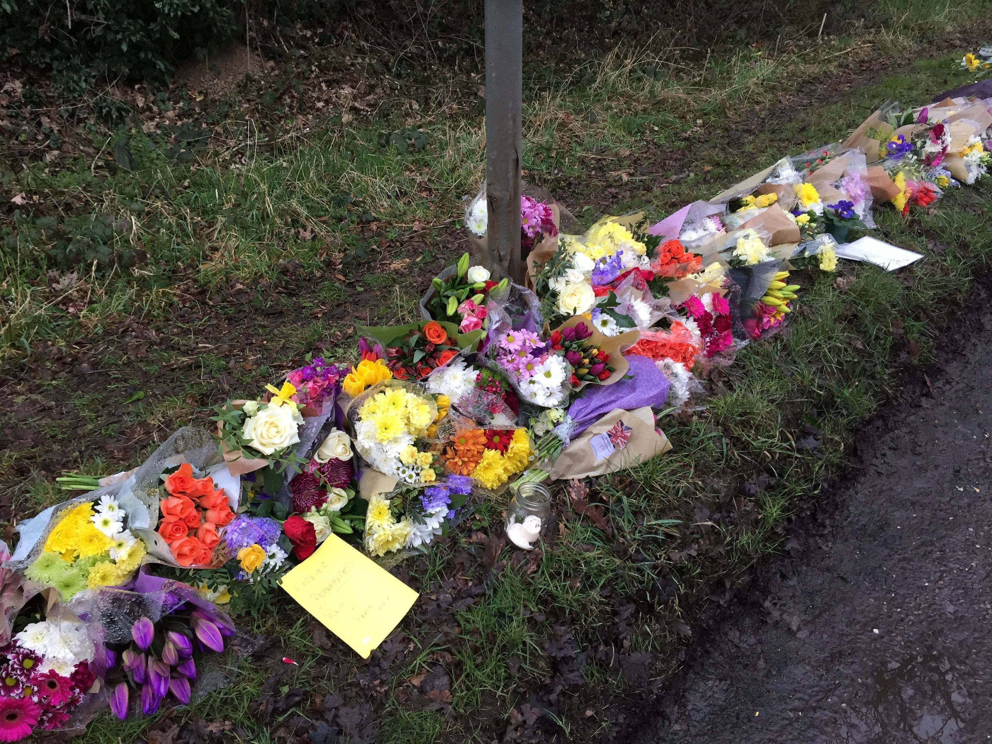 Flowers left in Barns Green, West Sussex, for William Hallet, 15 and his grandfather Barry Hearnshaw, 72 (Flora Thompson/PA)