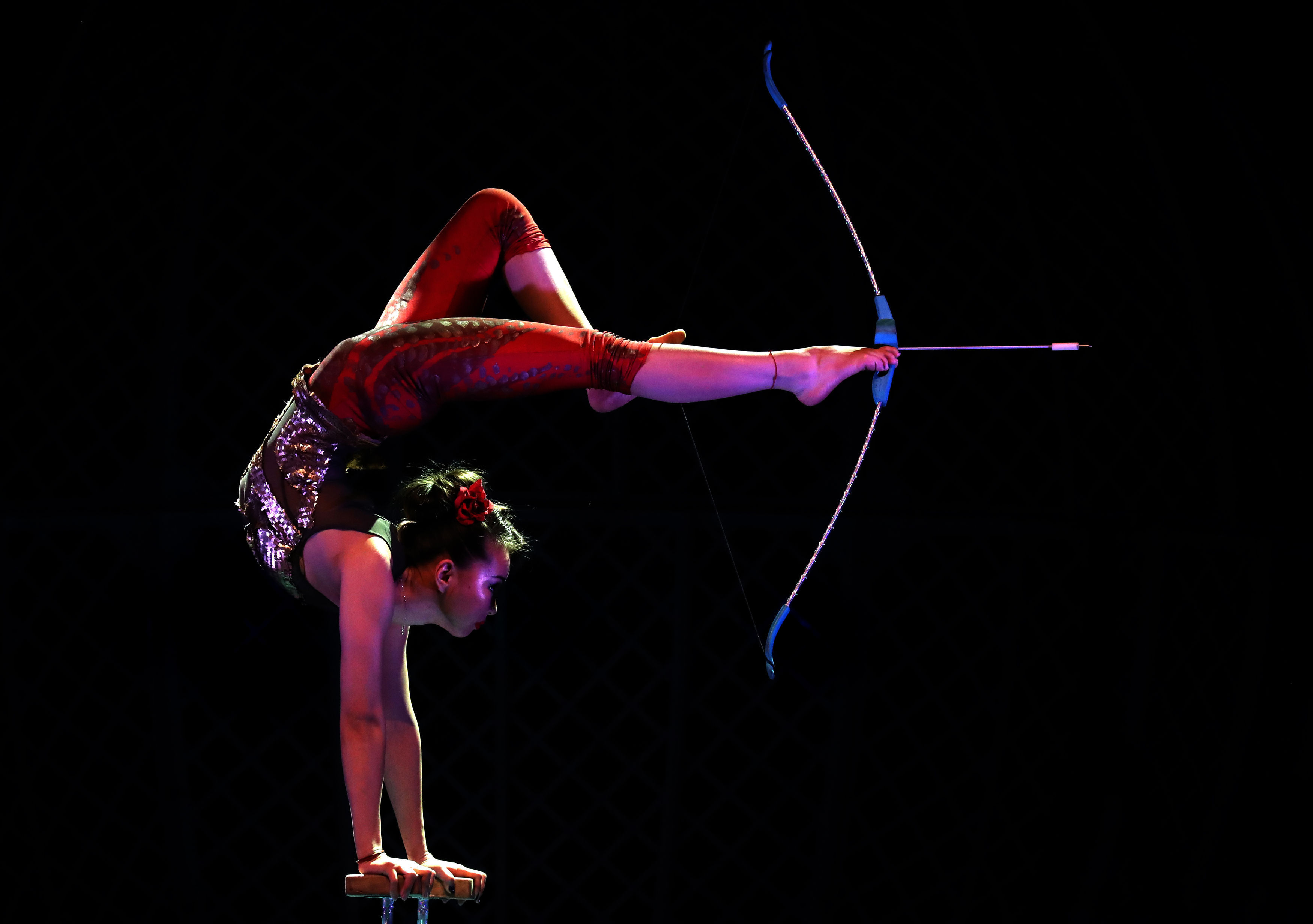 Contortionist Odka prepares to fire an arrow (Andrew Milligan/PA)