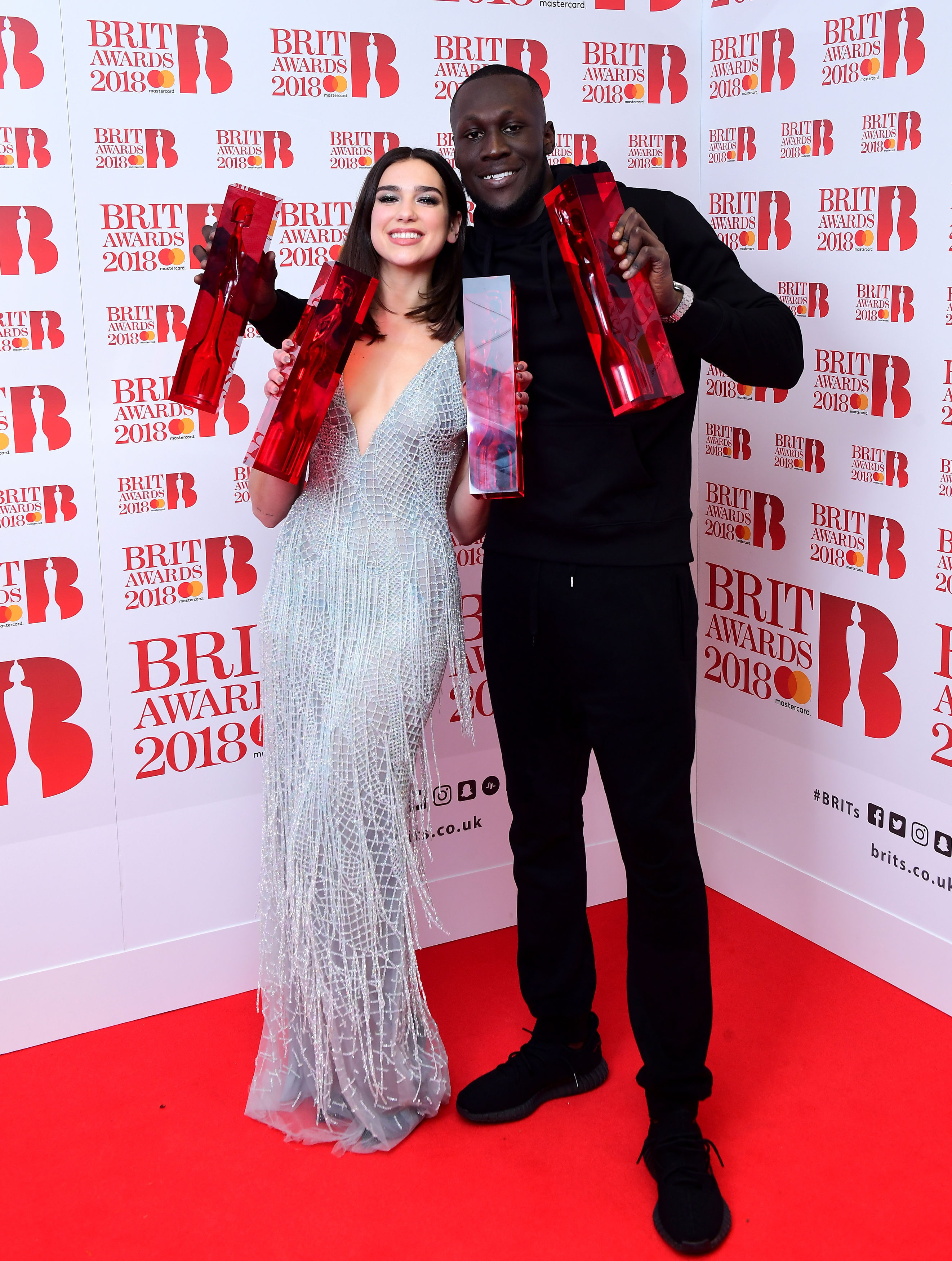 Dua Lipa with her awards for Best British Female Solo Artist and Breakthrough Act, and Stormzy with his British Album of the Year and British Male Solo Artist awards