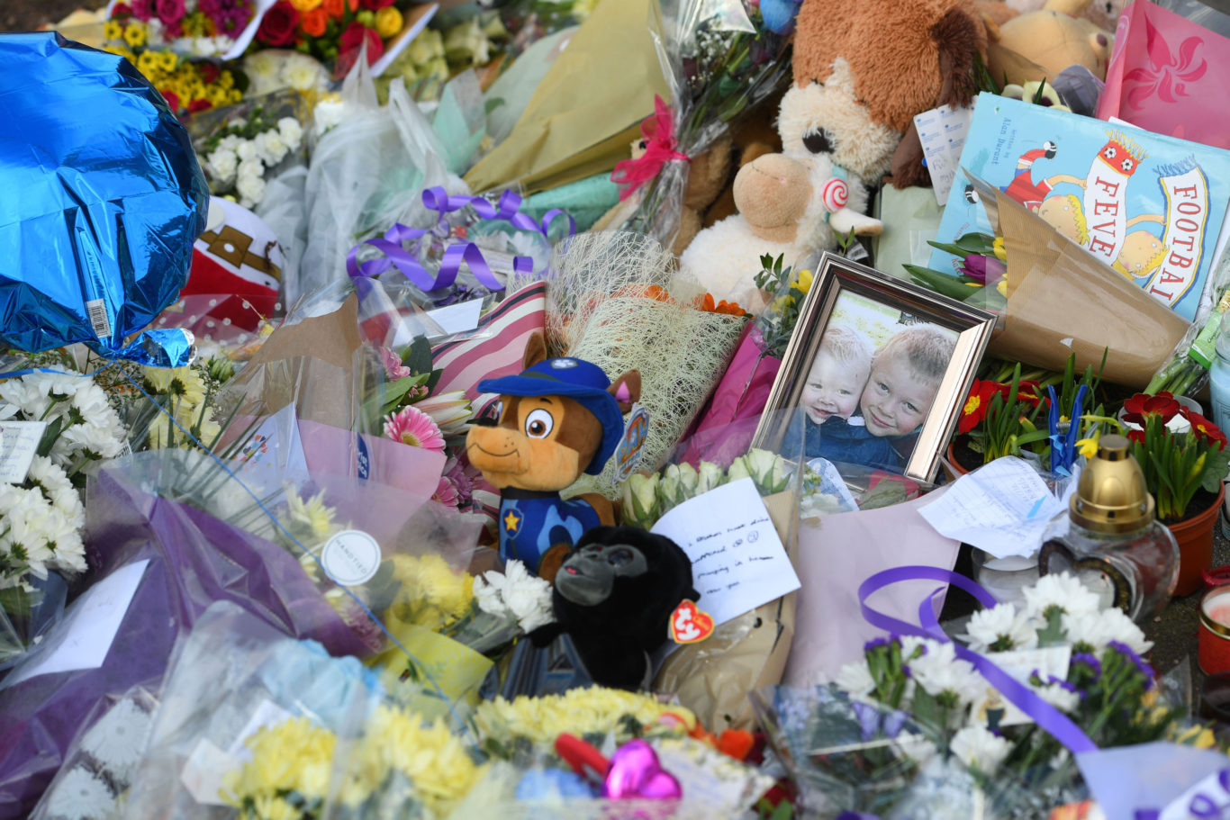 Flowers close to the scene where brothers Corey Platt-May and Casper, aged six and two, were killed (Joe Giddens/PA)