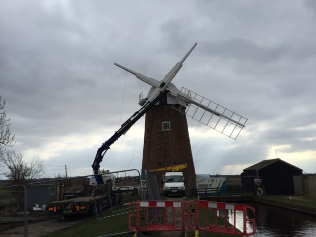 The first new sail is attached to Horsey mill in Norfolk (PA/ Sam Russell)