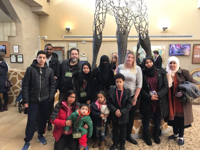 Some of the 77 people people from the Grenfell Tower community who went to Chessington Zoo (Angie Mays/PA)