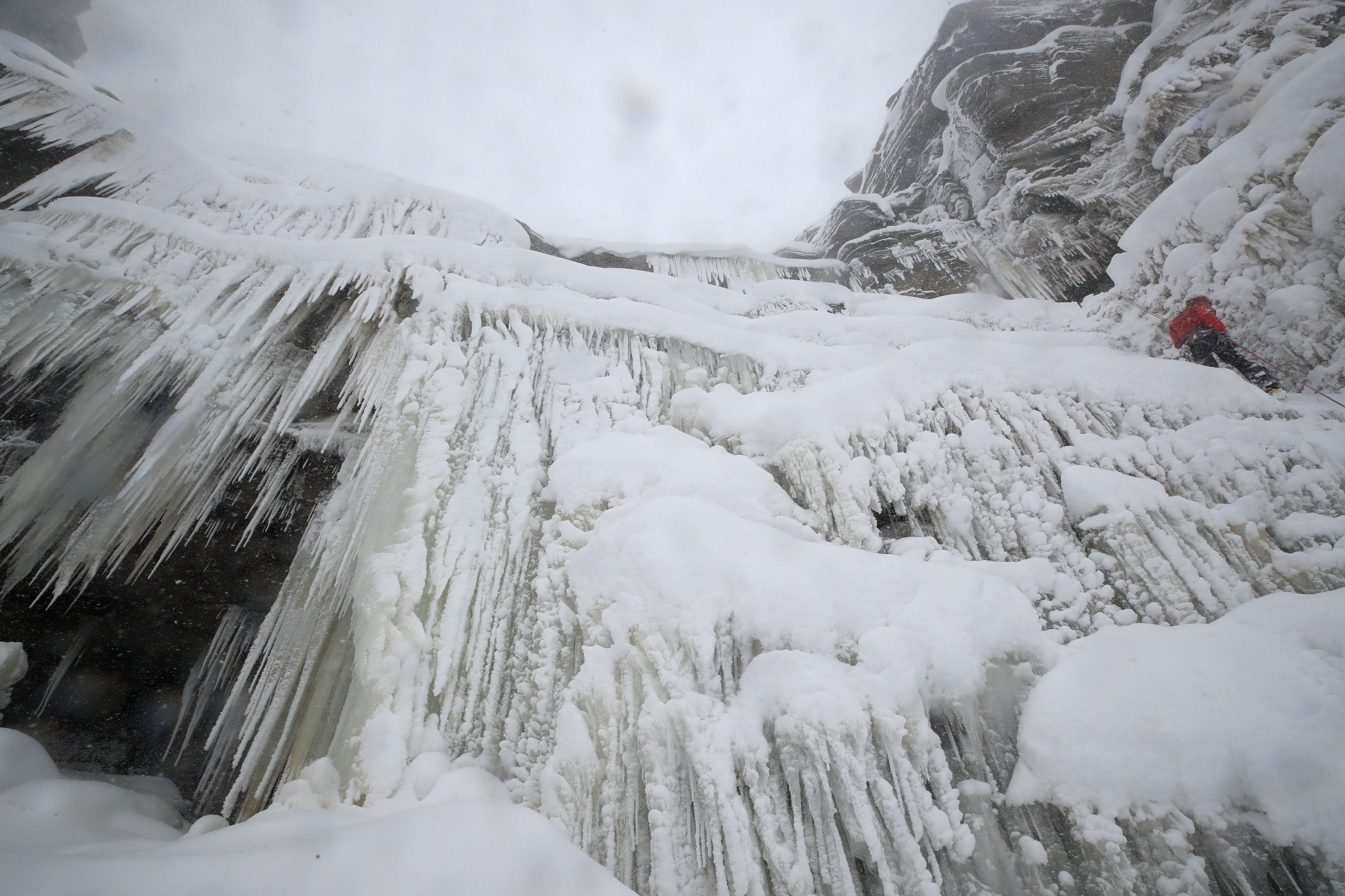 Ice climbers on the downfall at Kinder Downfall, High Peak in Derbyshire