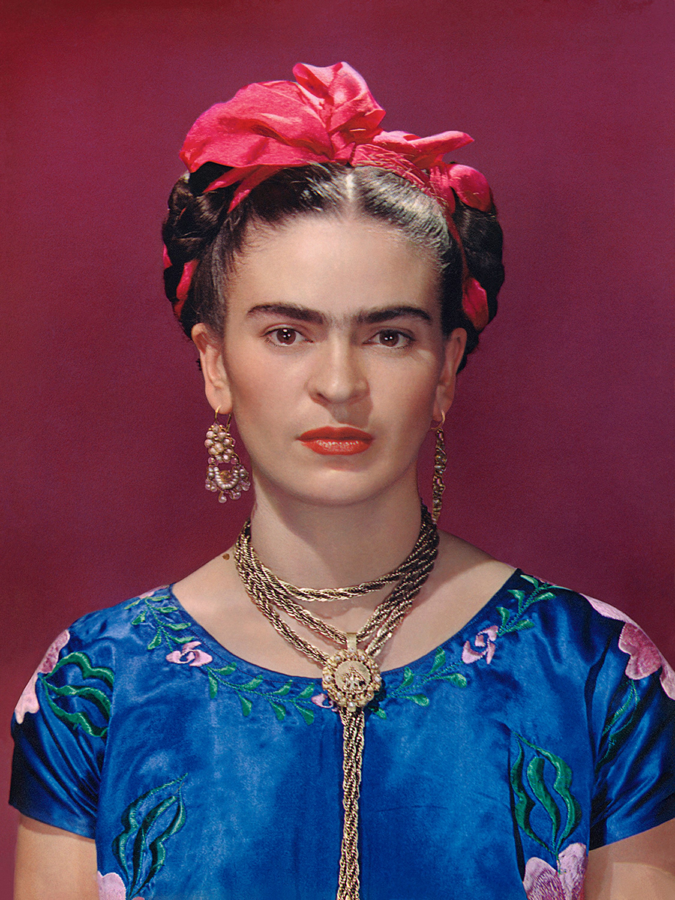 Frida Kahlo in blue satin blouse, 1939, photograph by Nickolas Muray  (Nickolas Muray Photo Archives)