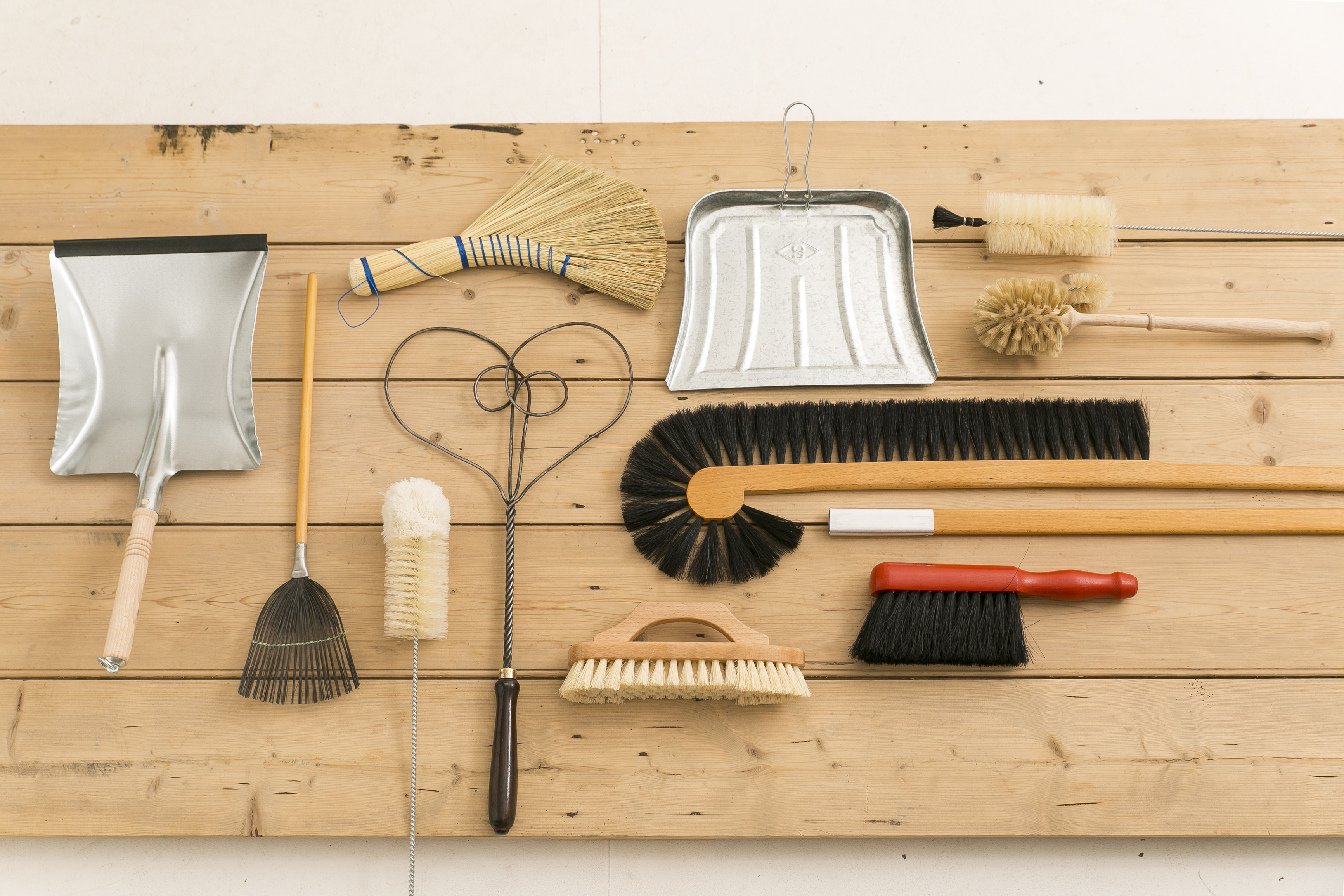 (l-r) Dustpan, £9; Fly Swat, £9; Bottle Brush, £6.75; Rice Straw Hand Brush, £7.50; (heart shaped) Old Carpet Beater, £14.50; Dustpa ?; Extending Cupboard Brush, £35; Red Handled Brush, £6.50; Bottle Brush, £7; Loo Brush with Rim Cleaner, £8, RE for the Home (RE for the home/PA)