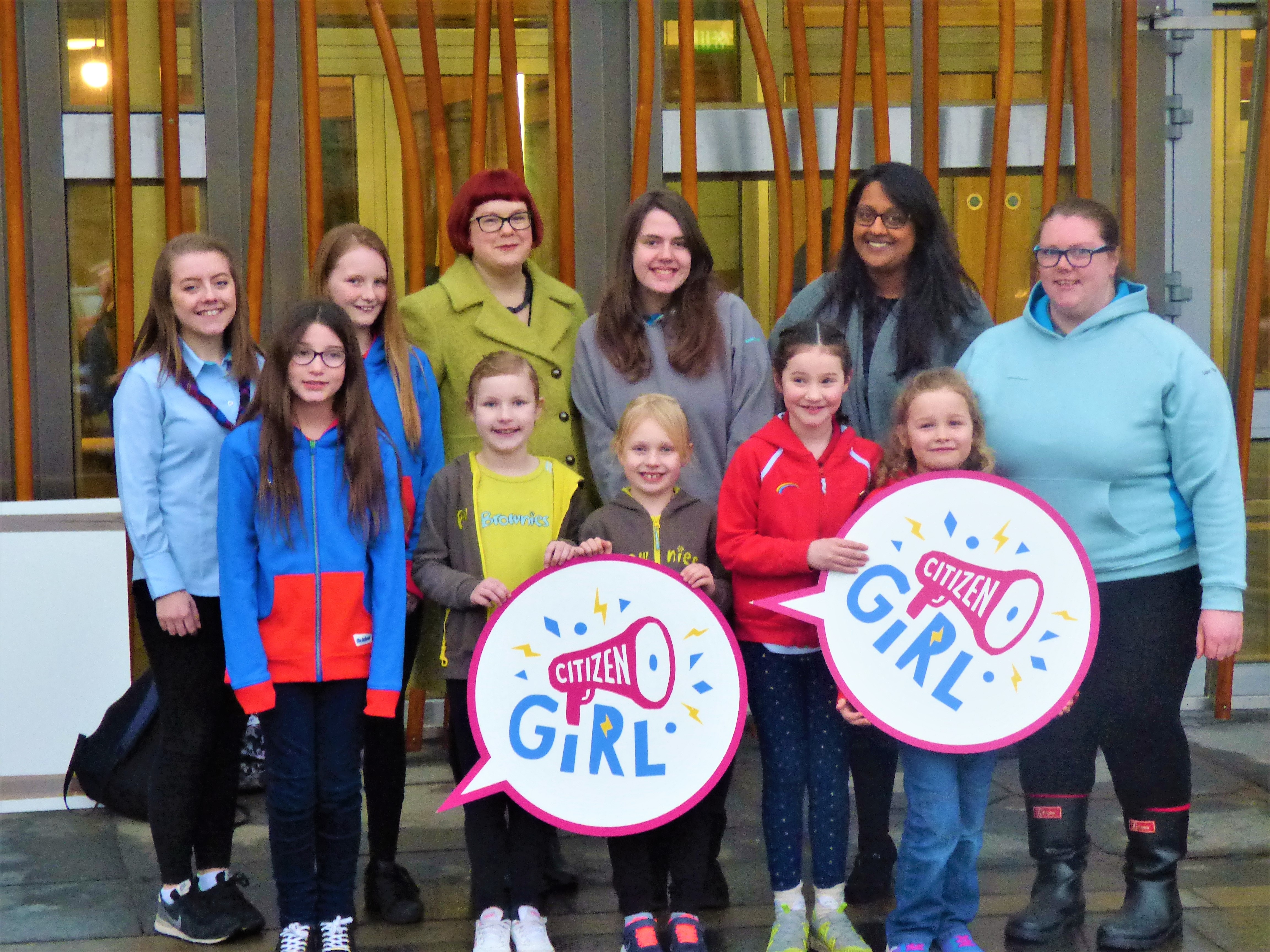 Emma Ritch of Women 50:50 (3rd from left back row) and Talat Yaqoob, co-founder of Women 50:50, (2nd from right back row) with Girlguiding Scotland members (Girlguiding Scotland/PA)