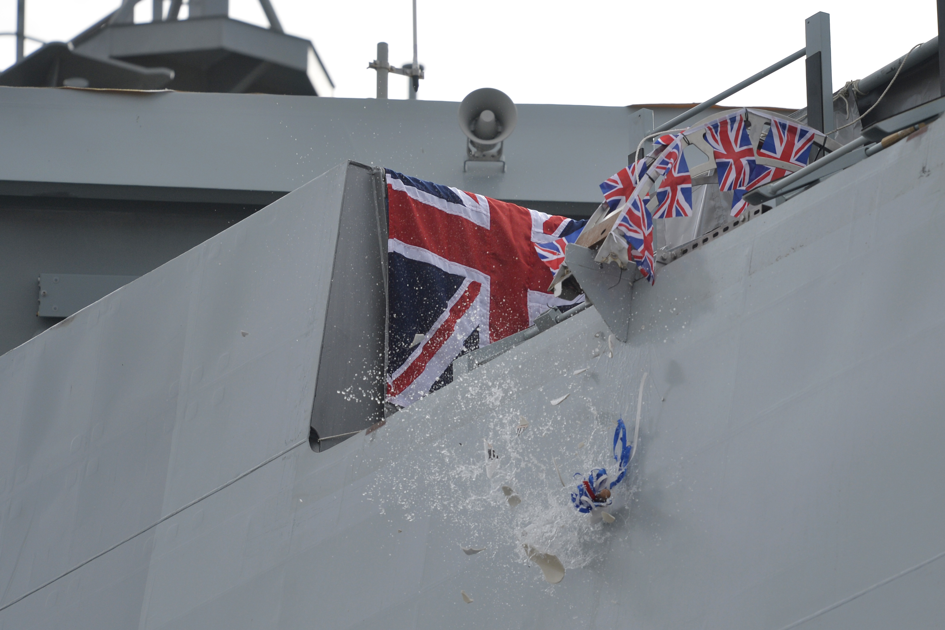 A bottle from Nelson's Gin Distillery & Gin School was smashed onto the ship during the ceremony (John Linton/PA)