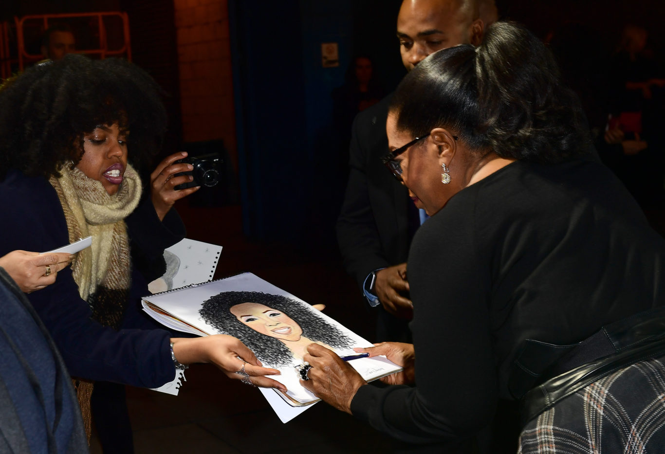 Oprah Winfrey signs autographs for fans (Ian West/PA)