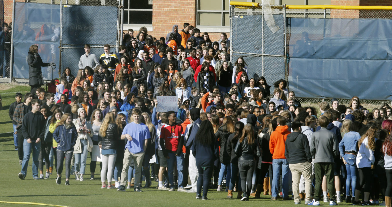 Students from Douglas Freeman High School walk out of school to protest gun violence in Richmond, Virginia ( Steve Helber/AP)