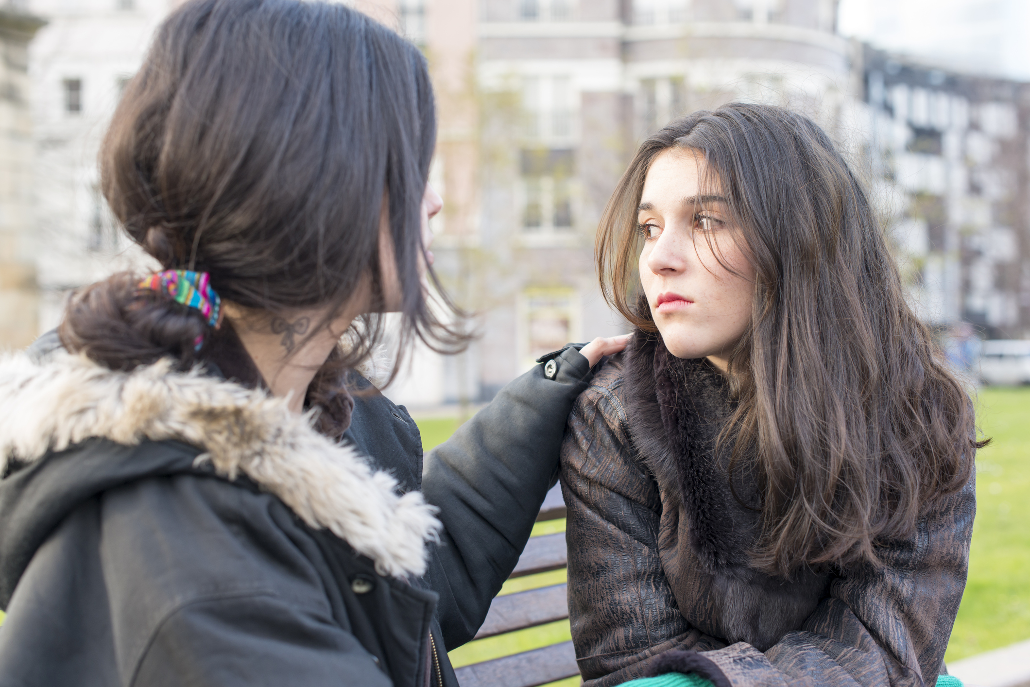 Female student comforting her friend (kissenbo/Getty Images)