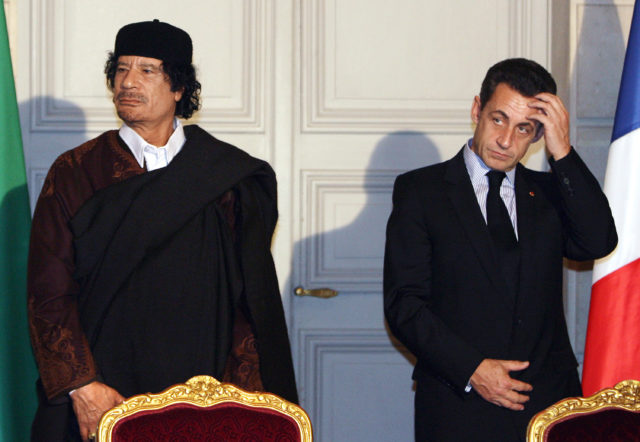 Muammar Gaddafi and Nicolas Sarkozy in 2007 (Patrick Hertzog, Pool via AP)