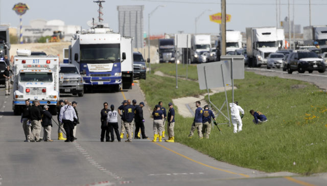 Officials at the scene in Round Rock, Texas (Eric Gay/AP)