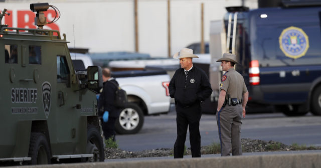 Officials investigate the scene (Eric Gay/AP)