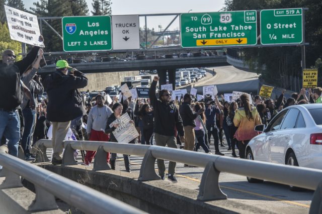 Hundreds of protesters demonstrate against the fatal police shooting of Stephon Clark (Renee C Byer/The Sacramento Bee via AP)