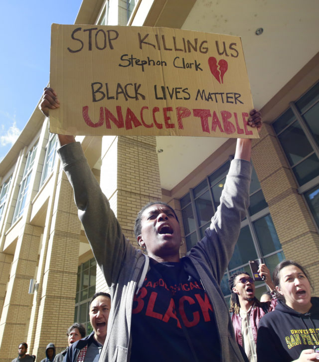 Demonstrators gather outside Sacramento City Hall (Rich Pedroncelli/AP)