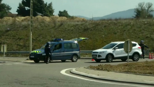 A police vehicle parked on a crossroad in Trebes (BFM TV via AP)