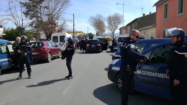 Police attend the incident in Trebes (La Depeche Du Midi via AP)