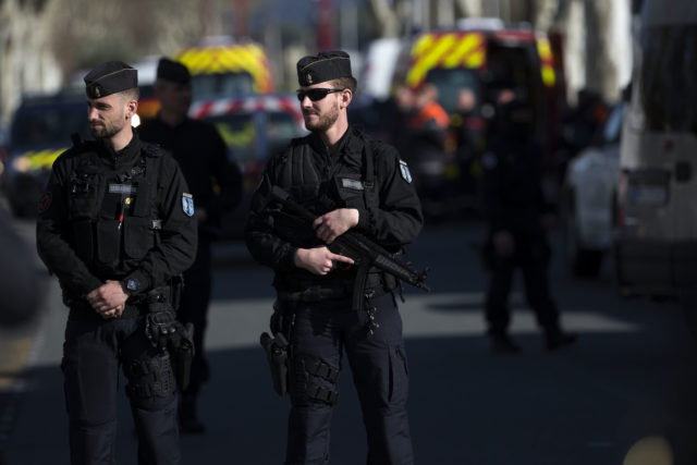 French police officers cordon off the area (Emilio Morenatti/AP)