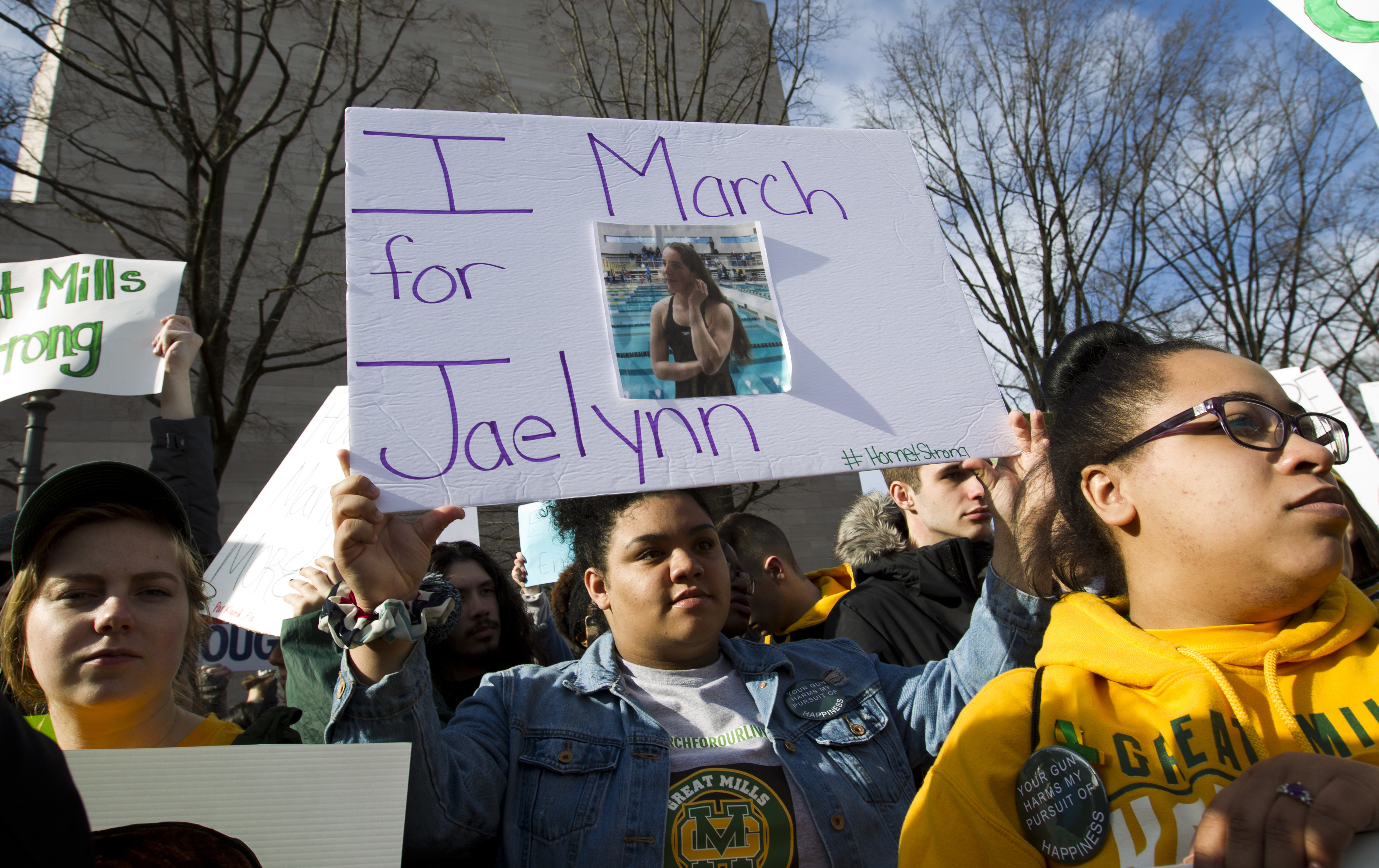 Ayanne Johnson, a student from Great Mills High School in southern Maryland, holds up the photograph of her classmate Jaelynn Willey during the March For Our Lives rally in Washington (Jose Luis Magana/AP)