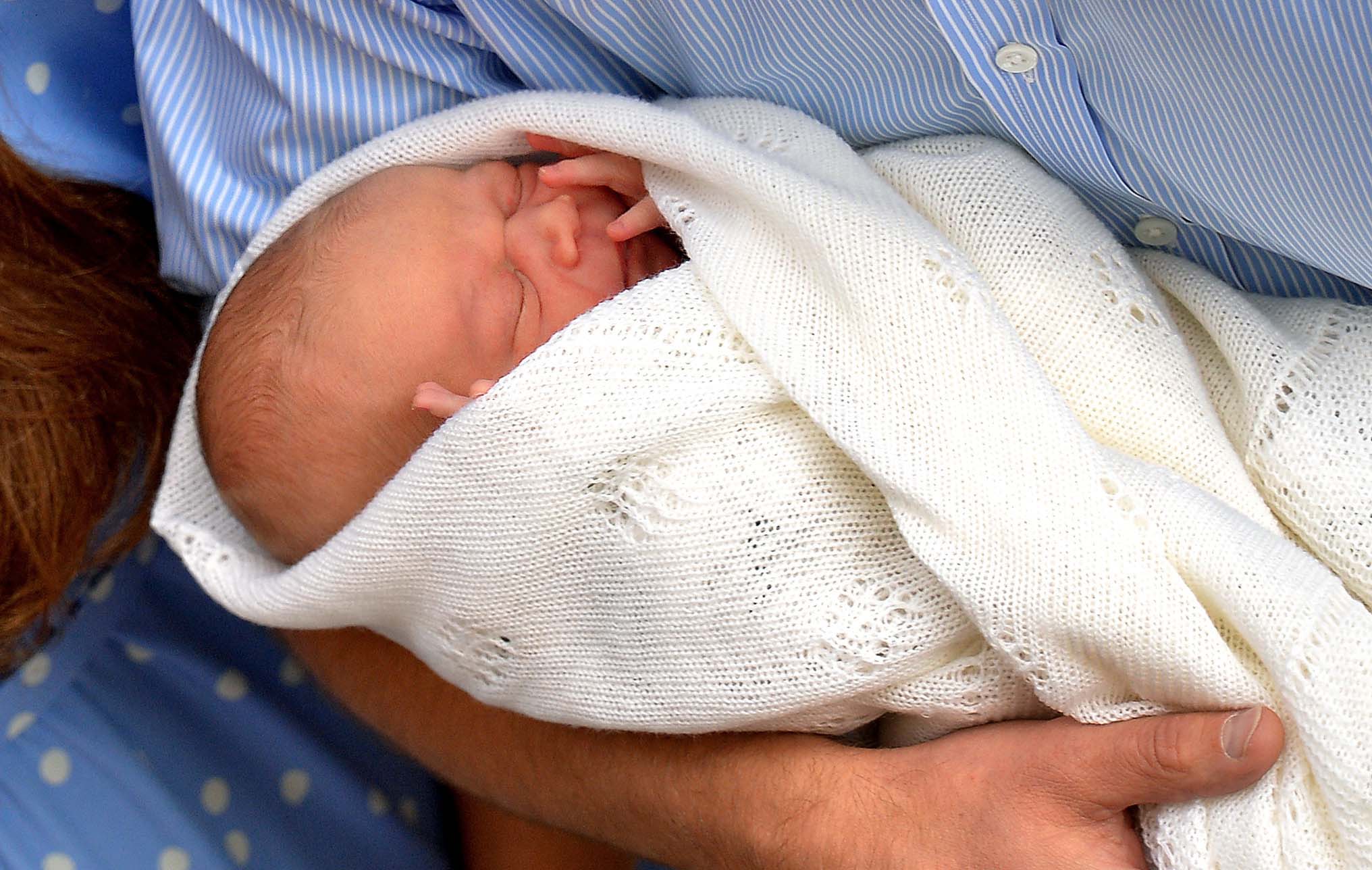 Prince George the day after he was born (John Stillwell/PA)