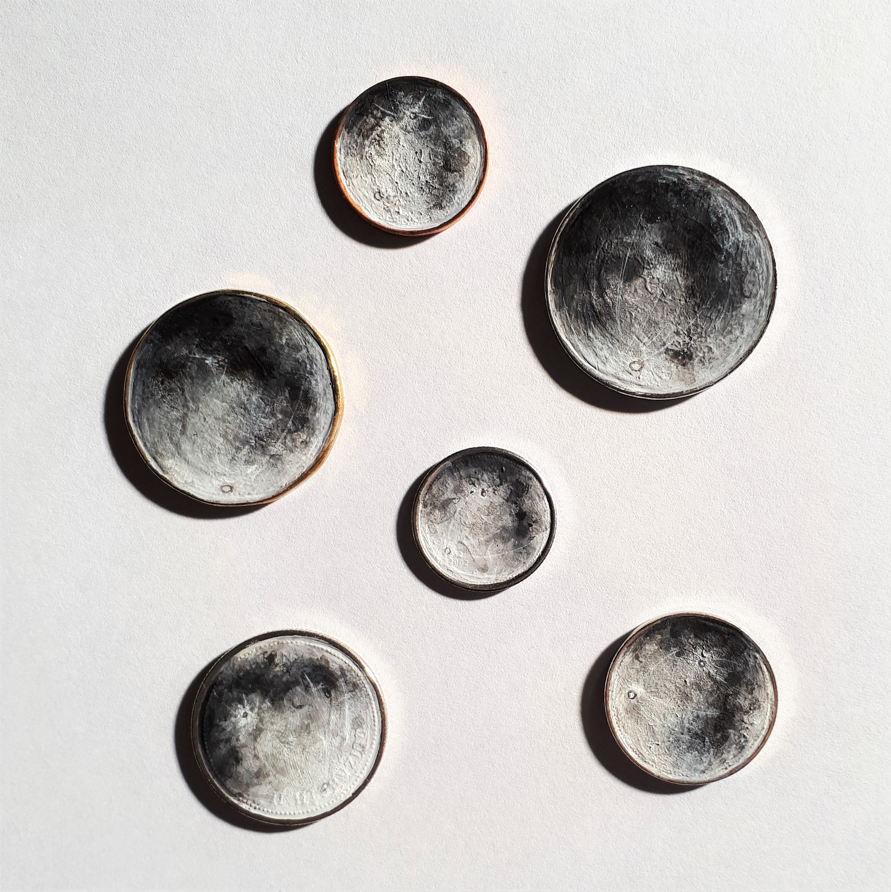 Coins as moons