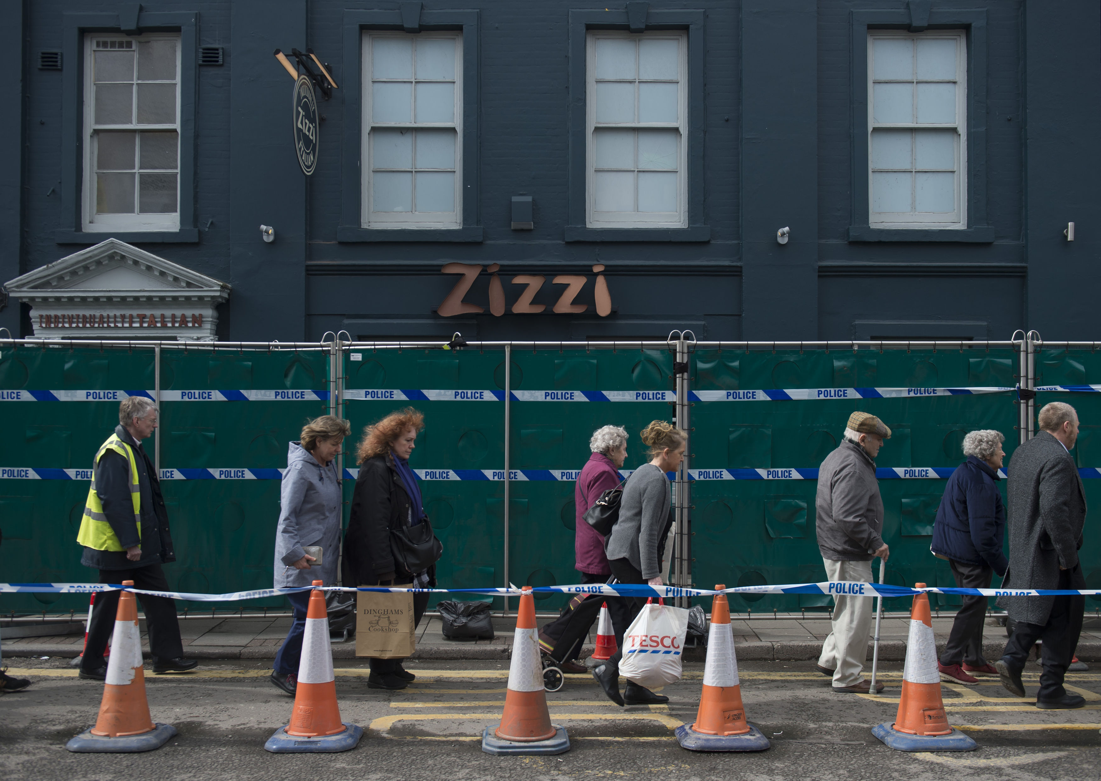 Members of the public walk past the Zizzi restaurant in Salisbury (David Mirzoeff/PA)