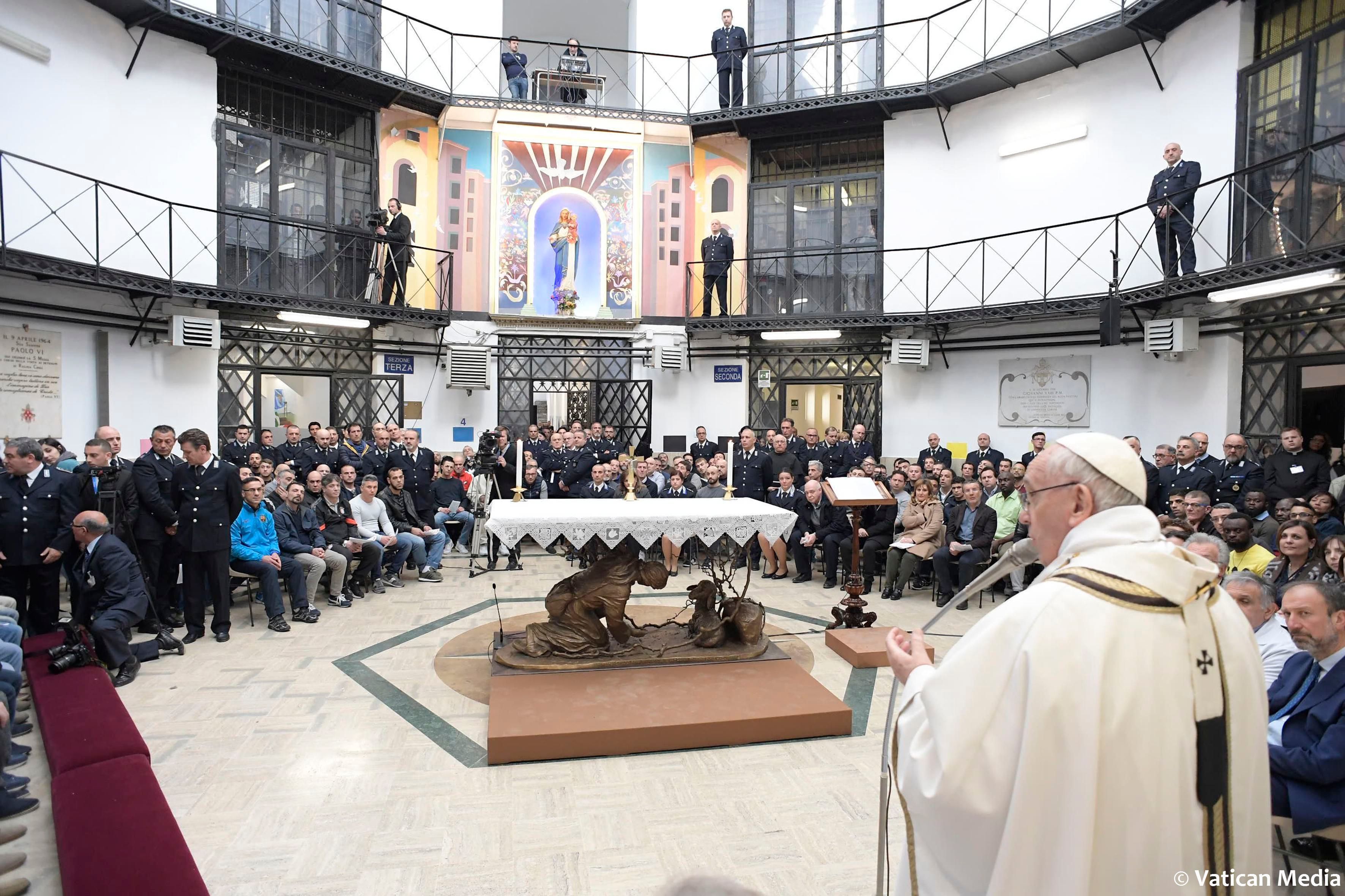 Pope Francis leads a mass during his visit to the Regina Coeli jail in Rome (Vatican Media via AP)