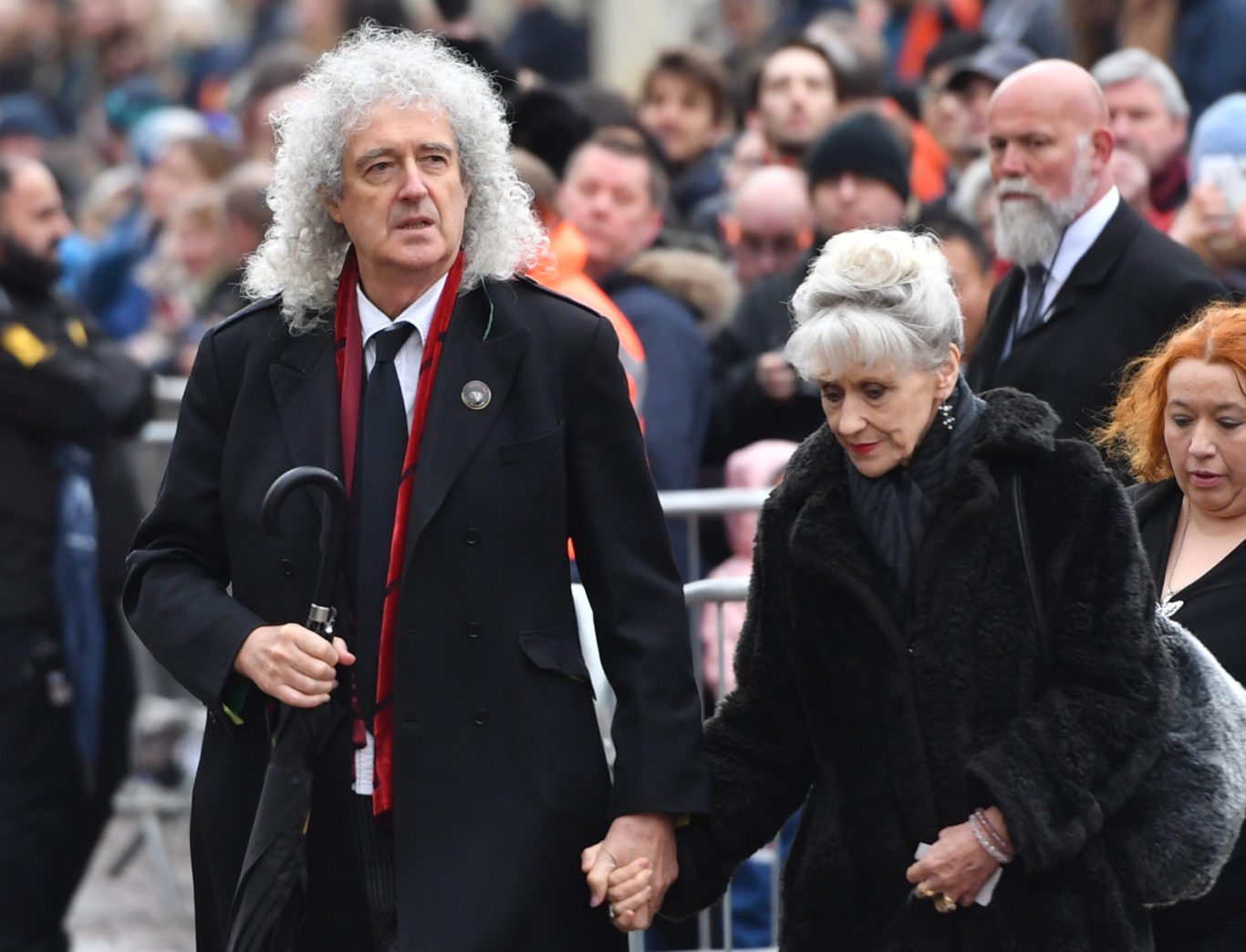 Brian May and Anita Dobson arrive for the funeral (Joe Giddens/PA)