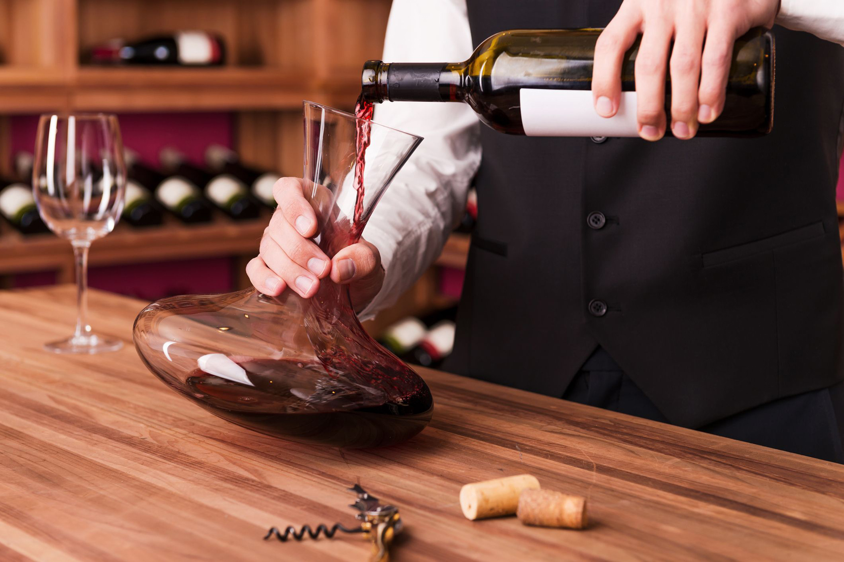 Sommelier pouring wine into a decanter