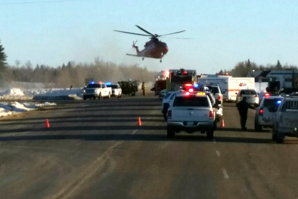 Emergency crews at the scene (650 CKOM/980 CJME via AP)