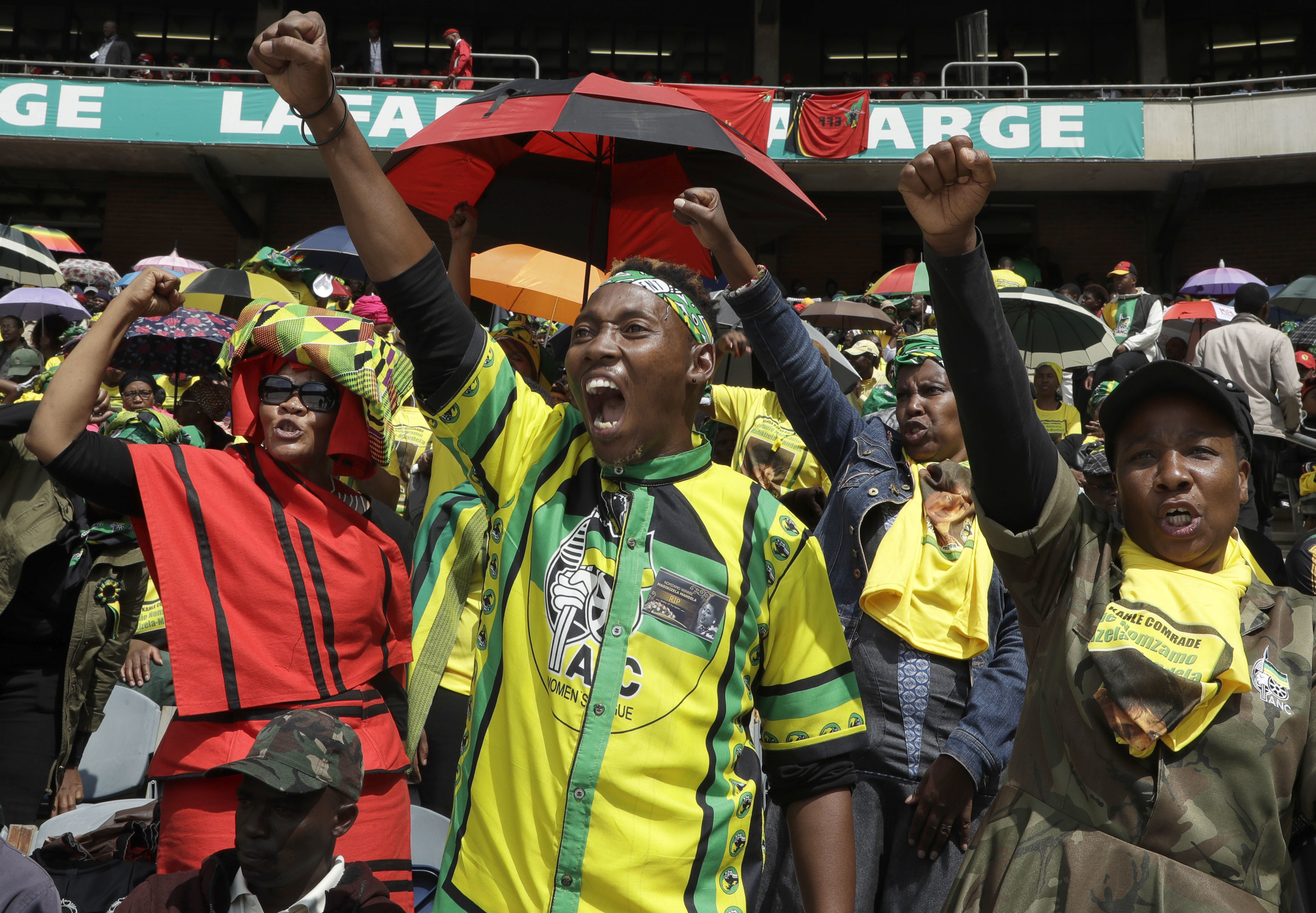 Mourners shout slogans at the memorial service (Themba Hadebe/AP)