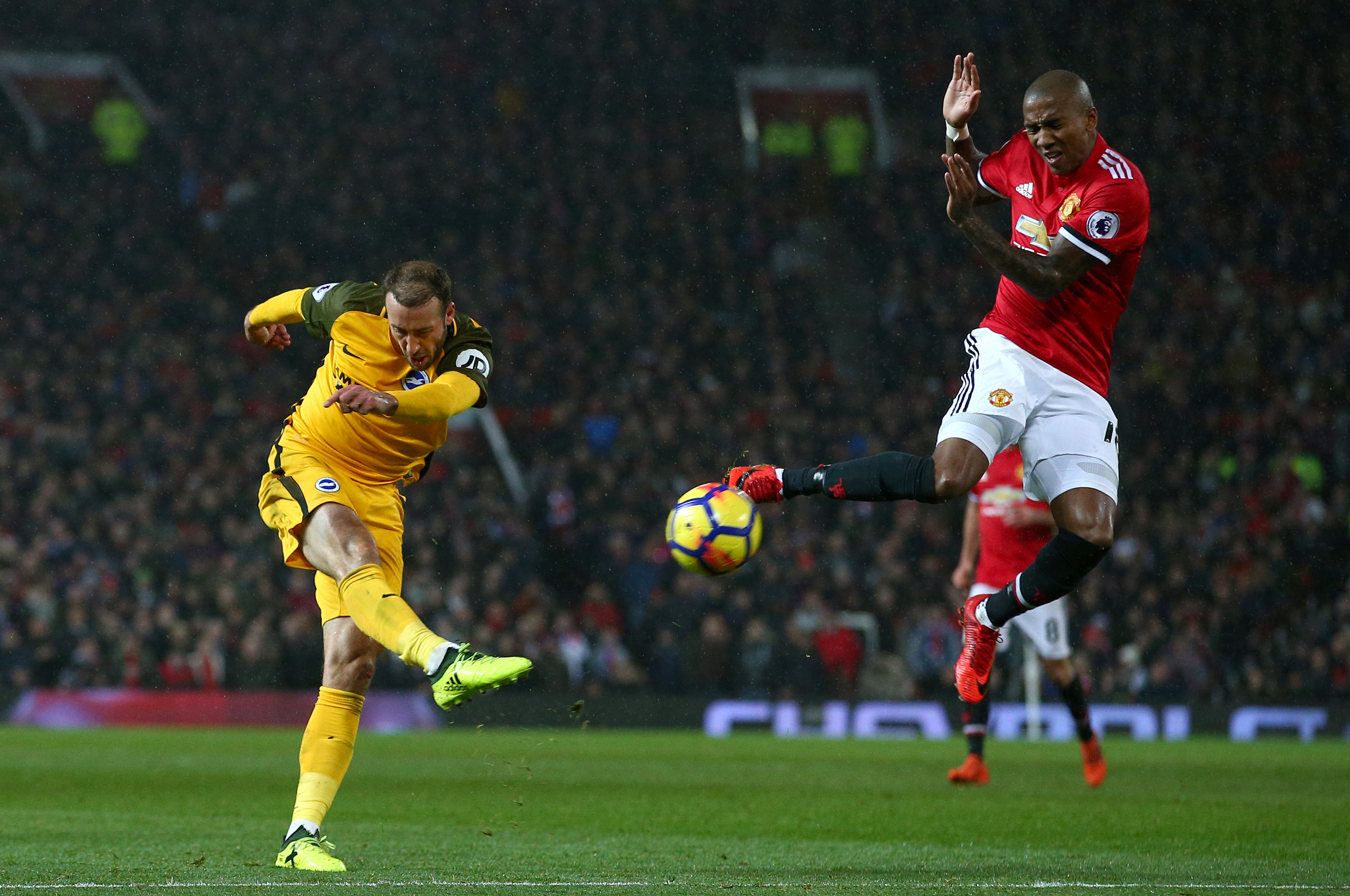 Ashley Young goes to block the ball in a game against Brighton