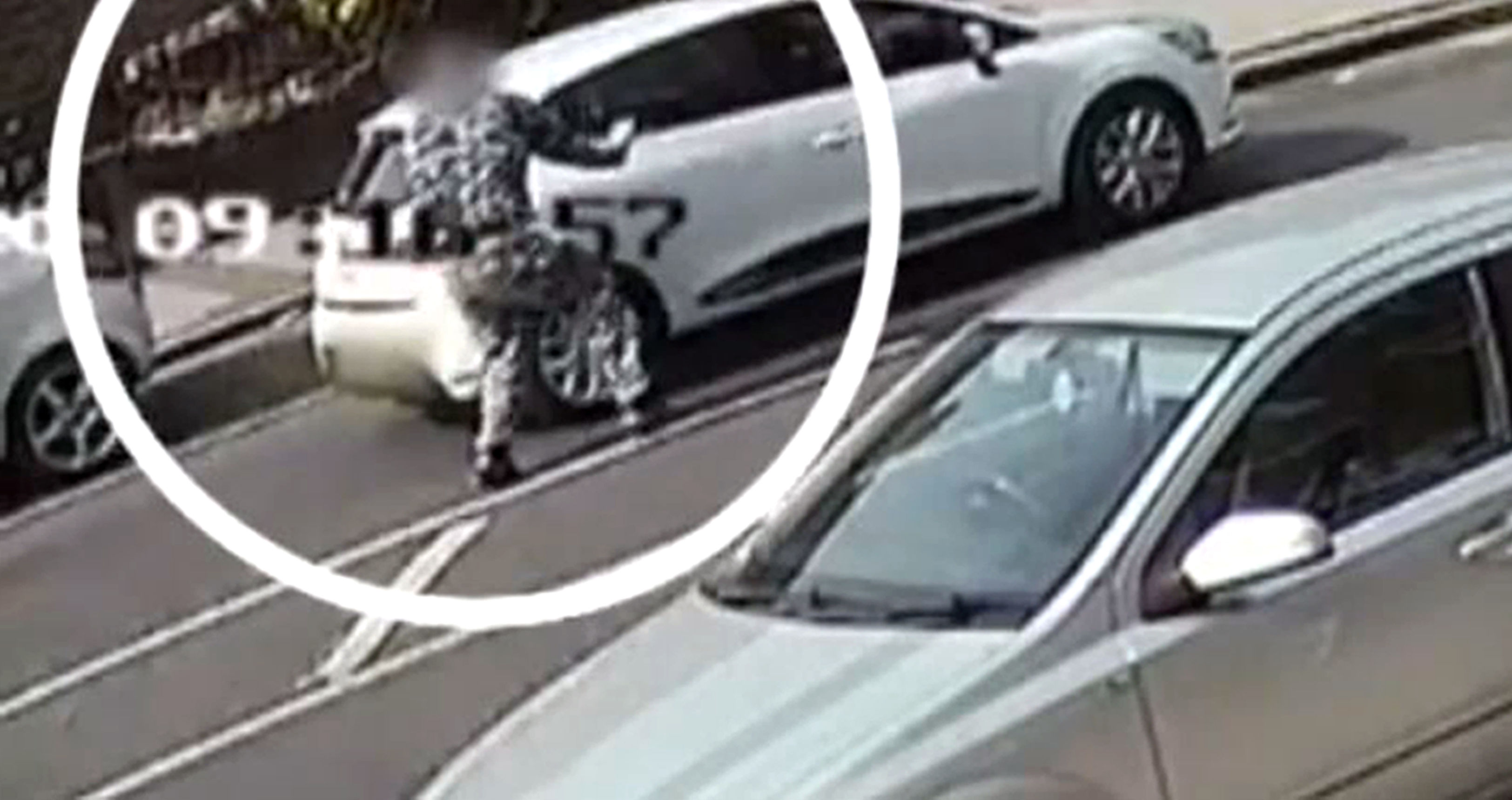 A CCTV image of John Tomlin throwing a substance into a car (Metropolitan Police/PA)