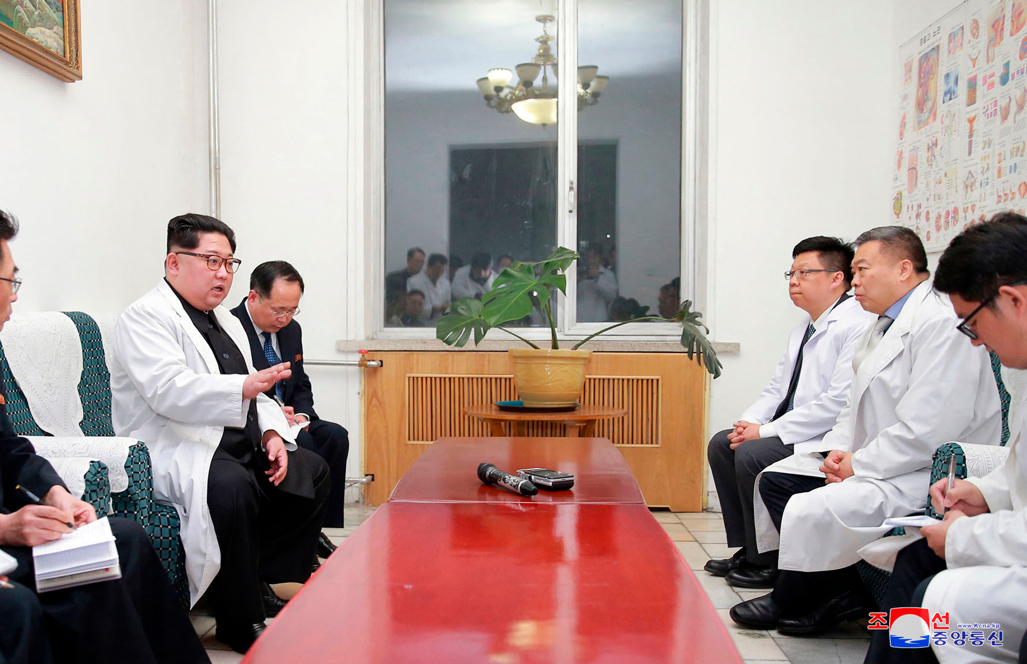 Kim Jong-un, left, meets China's ambassador to North Korea Li Jinjun, second from right (Korean Central News Agency/Korea News Service via AP)