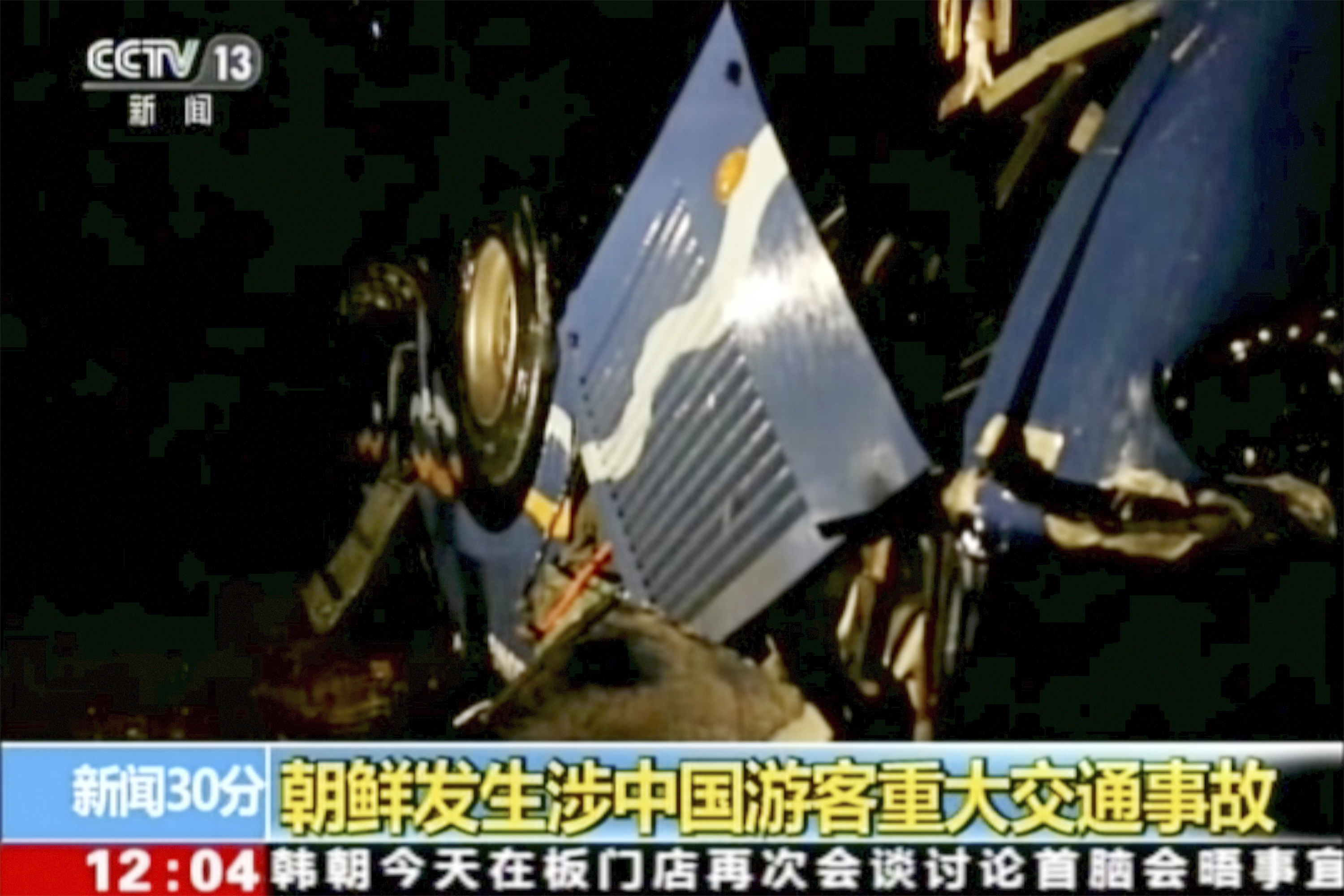 The bus overturned after an accident in North Hwanghae province (CCTV via AP Video)