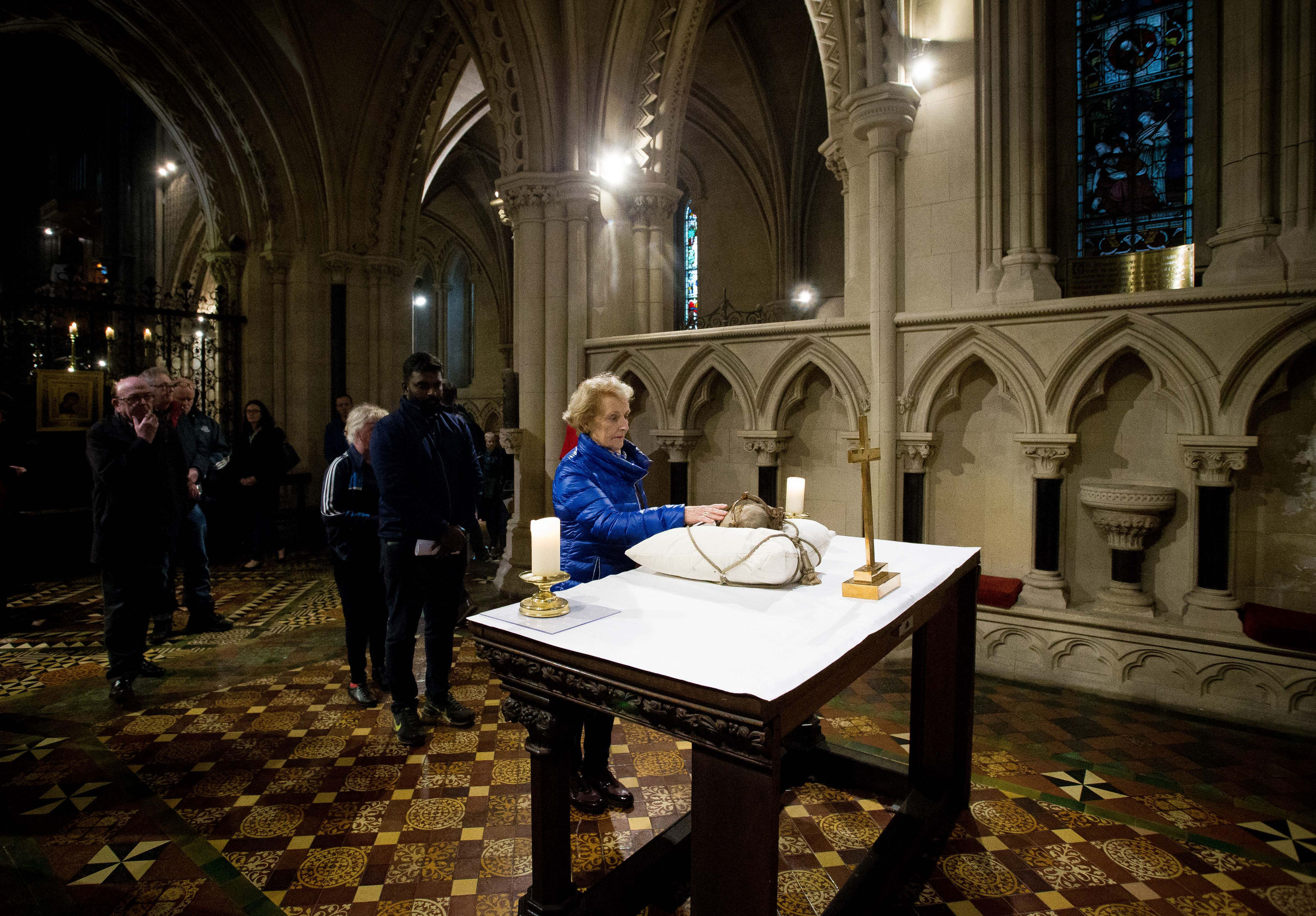 People line up to observe the heart of St Laurence O'Toole (Tom Honan/PA)