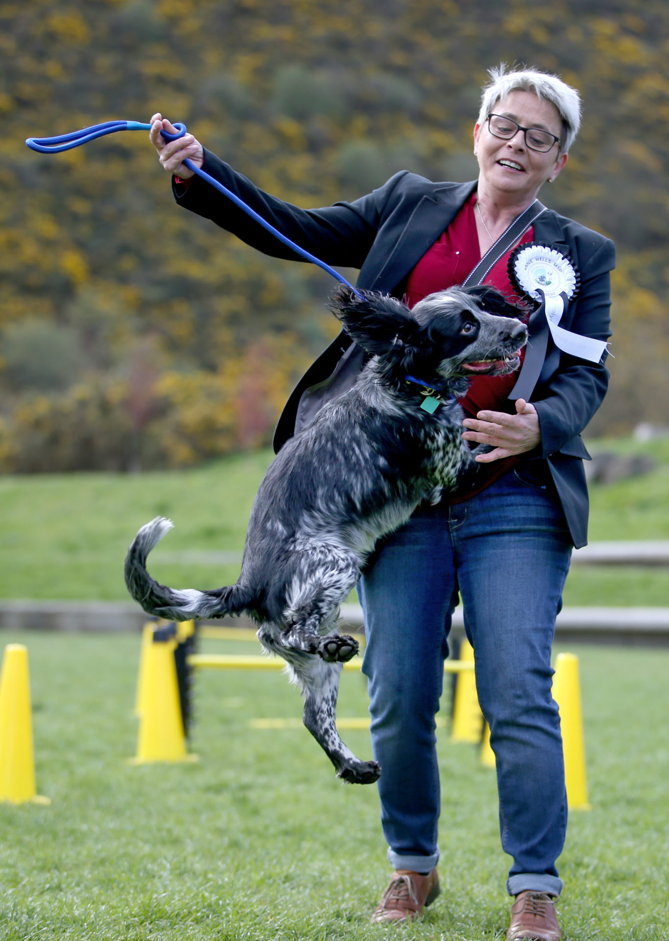 Politician Maurice Corry MSP and his dog Bobby tackle the obstacle course  (Jane Barlow/PA)